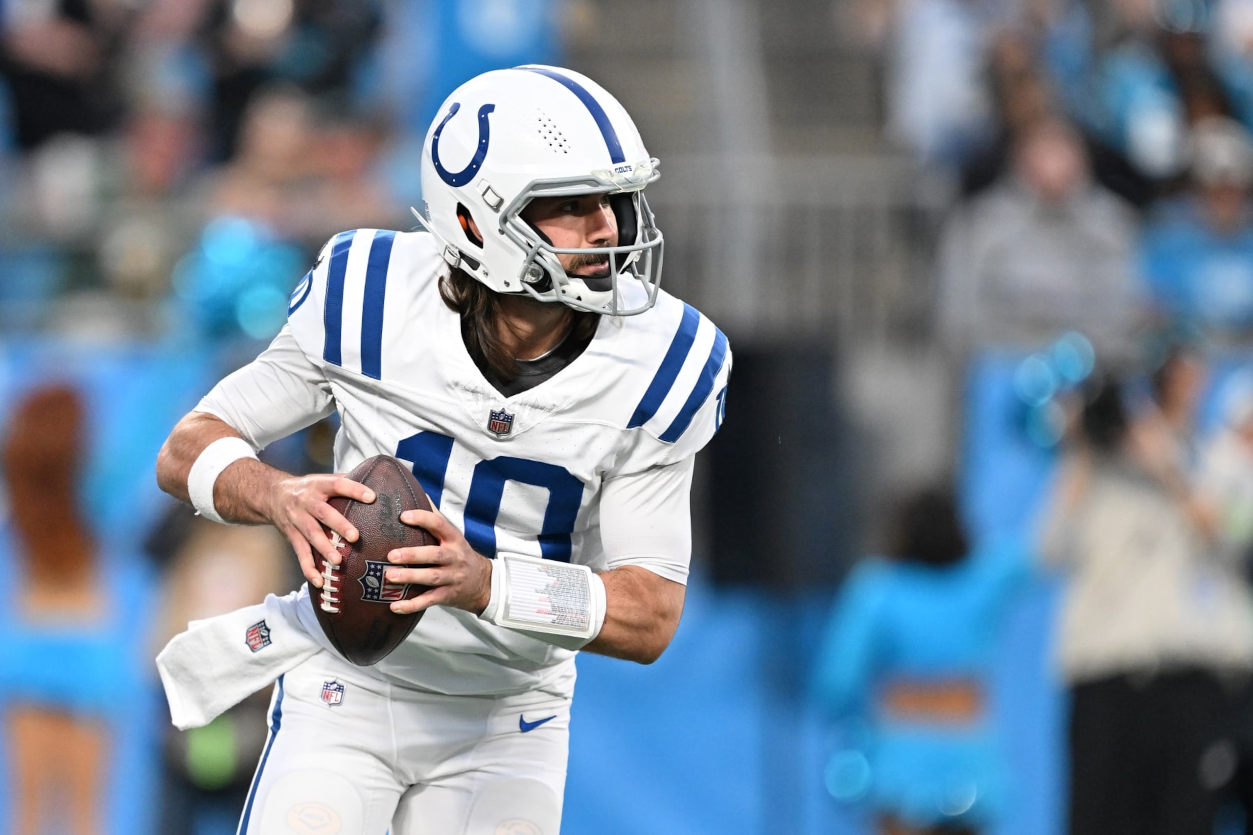 CHARLOTTE, NORTH CAROLINA - NOVEMBER 05: Gardner Minshew #10 of the Indianapolis Colts rolls out to pass against the Carolina Panthers during the game at Bank of America Stadium on November 05, 2023 in Charlotte, North Carolina. (Photo by Grant Halverson/Getty Images)