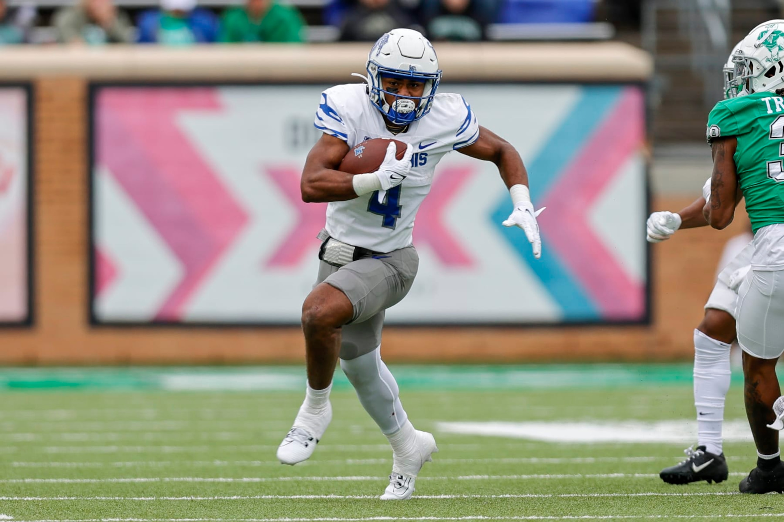 DENTON, TX - OCTOBER 28: Memphis Tigers running back Blake Watson (4) runs through the line of scrimmage during the game between the North Texas Mean Green and the Memphis Tigers on October 28, 2023 at DATCU Stadium in Denton, Texas. (Photo by Matthew Pearce/Icon Sportswire via Getty Images)
