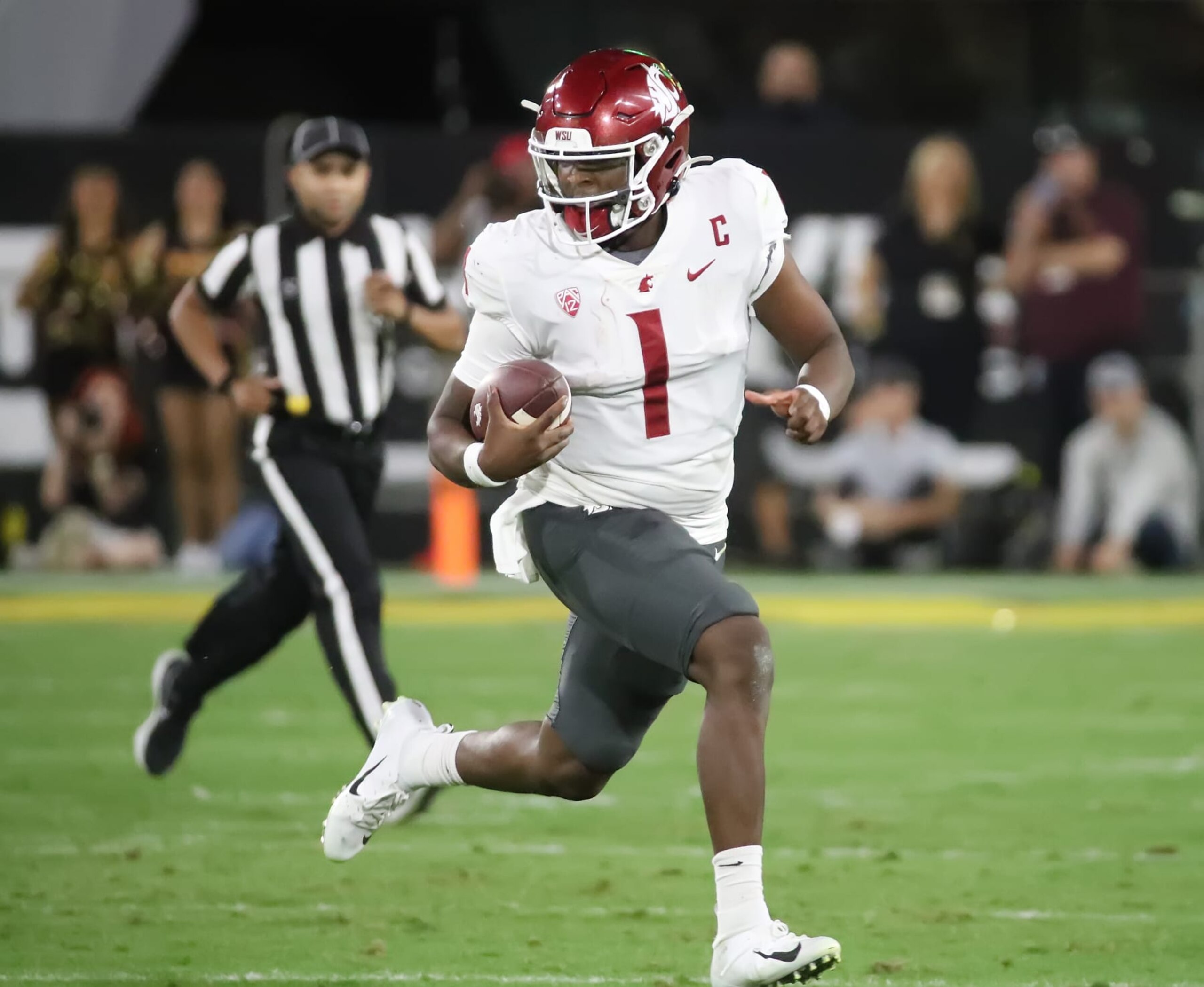 TEMPE, ARIZONA - OCTOBER 28: Cameron Ward #1 of the Washington State Cougars rushes for a first down in the second quarter against the Arizona State Sun Devils at Mountain America Stadium on October 28, 2023 in Tempe, Arizona. (Photo by Bruce Yeung/Getty Images)