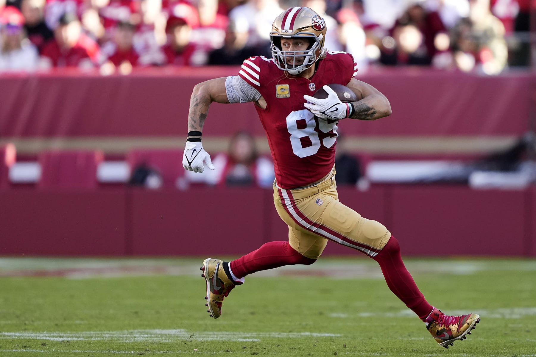 SANTA CLARA, CALIFORNIA - NOVEMBER 19: George Kittle #85 of the San Francisco 49ers runs with the ball during the third quarter of a game against the Tampa Bay Buccaneers at Levi's Stadium on November 19, 2023 in Santa Clara, California. (Photo by Thearon W. Henderson/Getty Images) SANTA CLARA, CALIFORNIA - NOVEMBER 19: George Kittle #85 of the San Francisco 49ers runs with the ball during the third quarter of a game against the Tampa Bay Buccaneers at Levi's Stadium on November 19, 2023 in Santa Clara, California. (Photo by Thearon W. Henderson/Getty Images)