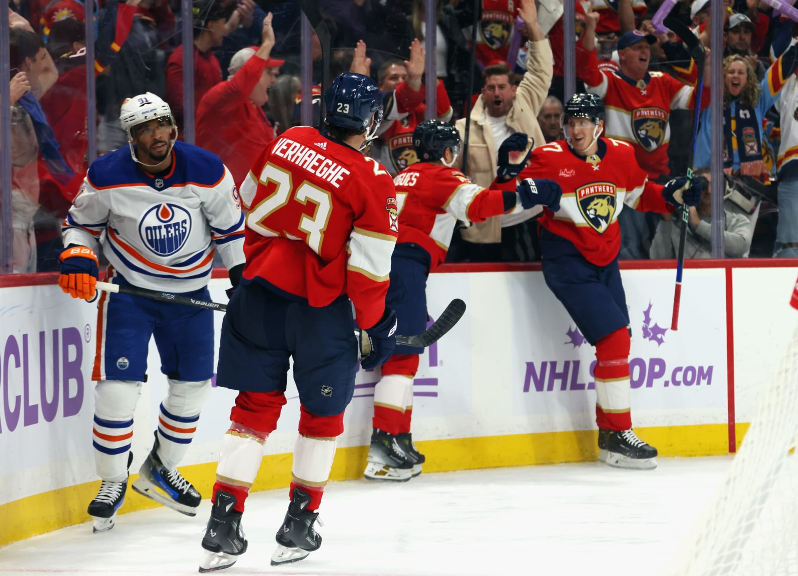 SUNRISE, FLORIDA - NOVEMBER 20: Niko Mikkola #77 of the Florida Panthers (R) scores at 6:08 of the second period against Calvin Pickard #30 of the Edmonton Oilers at Amerant Bank Arena on November 20, 2023 in Sunrise, Florida. (Photo by Bruce Bennett/Getty Images)