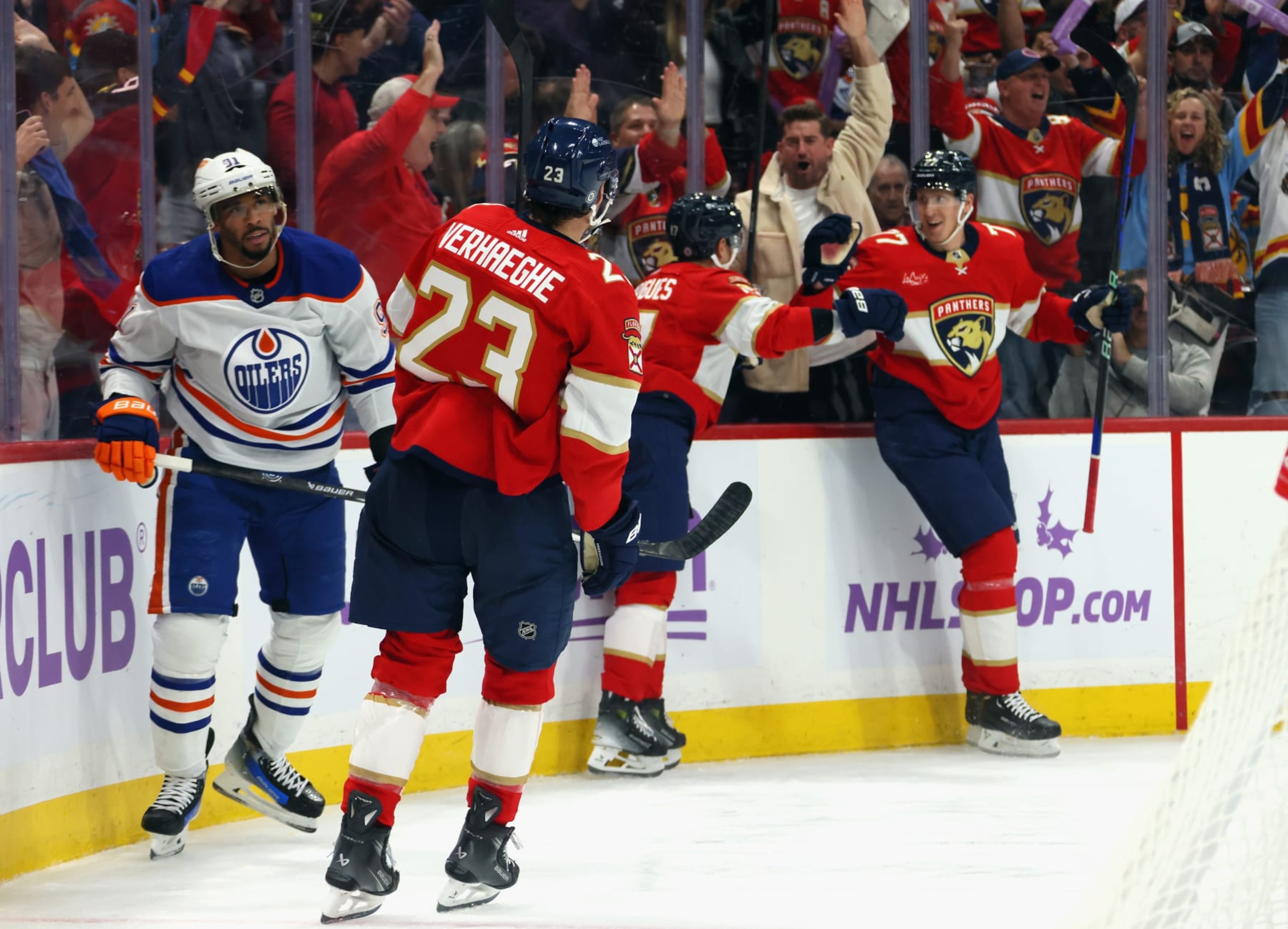 SUNRISE, FLORIDA - NOVEMBER 20: Niko Mikkola #77 of the Florida Panthers (R) scores at 6:08 of the second period against Calvin Pickard #30 of the Edmonton Oilers at Amerant Bank Arena on November 20, 2023 in Sunrise, Florida. (Photo by Bruce Bennett/Getty Images)