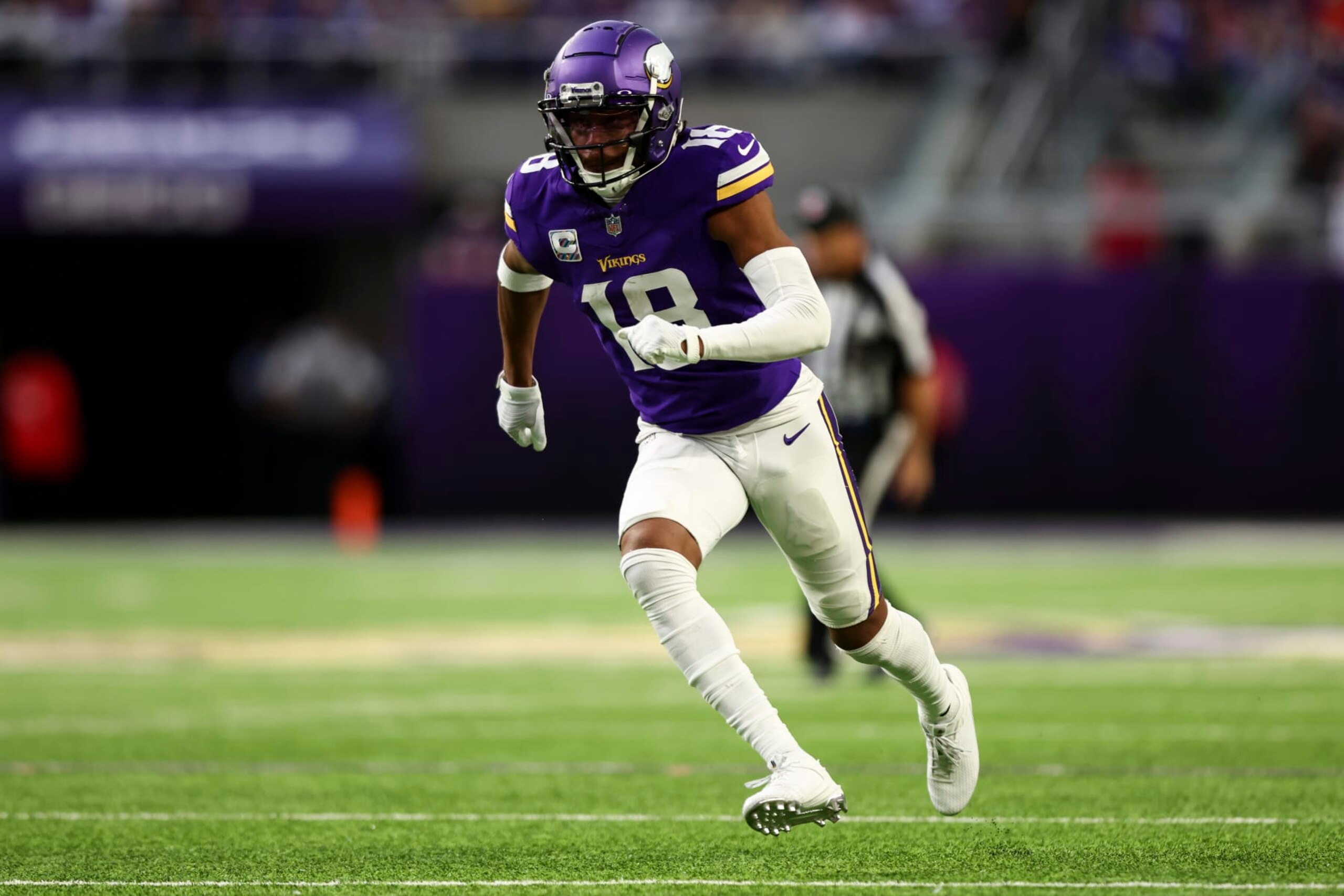 MINNEAPOLIS, MN - OCTOBER 08: Justin Jefferson #18 of the Minnesota Vikings runs downfield during the fourth quarter of an NFL football game against the Kansas City Chiefs at U.S. Bank Stadium on October 8, 2023 in Minneapolis, Minnesota. (Photo by Kevin Sabitus/Getty Images)