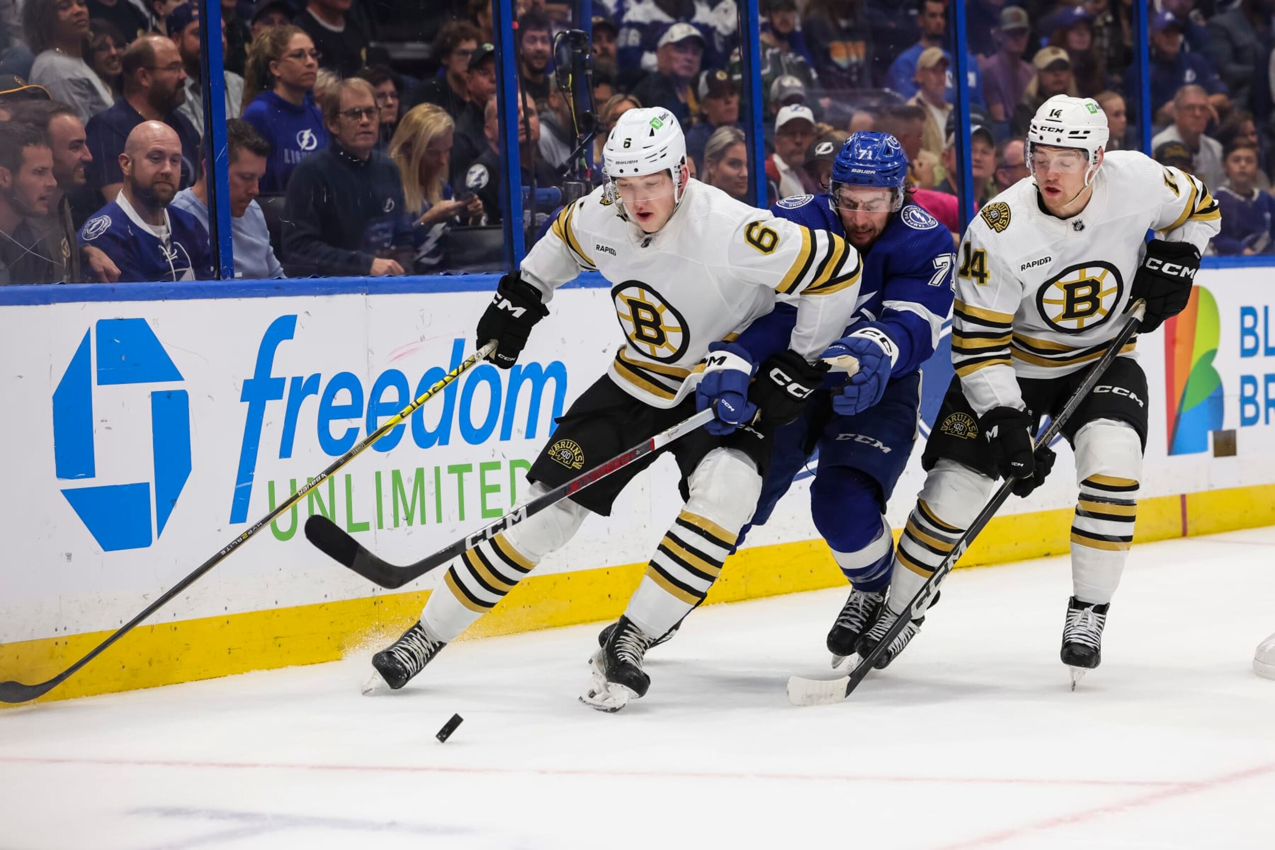 TAMPA, FL - NOVEMBER 20: Anthony Cirelli #71 of the Tampa Bay Lightning against Mason Lohrei #6 and Ian Mitchell #14 of the Boston Bruins during the second period at Amalie Arena on November 20, 2023 in Tampa, Florida. (Photo by Mark LoMoglio/NHLI via Getty Images)
