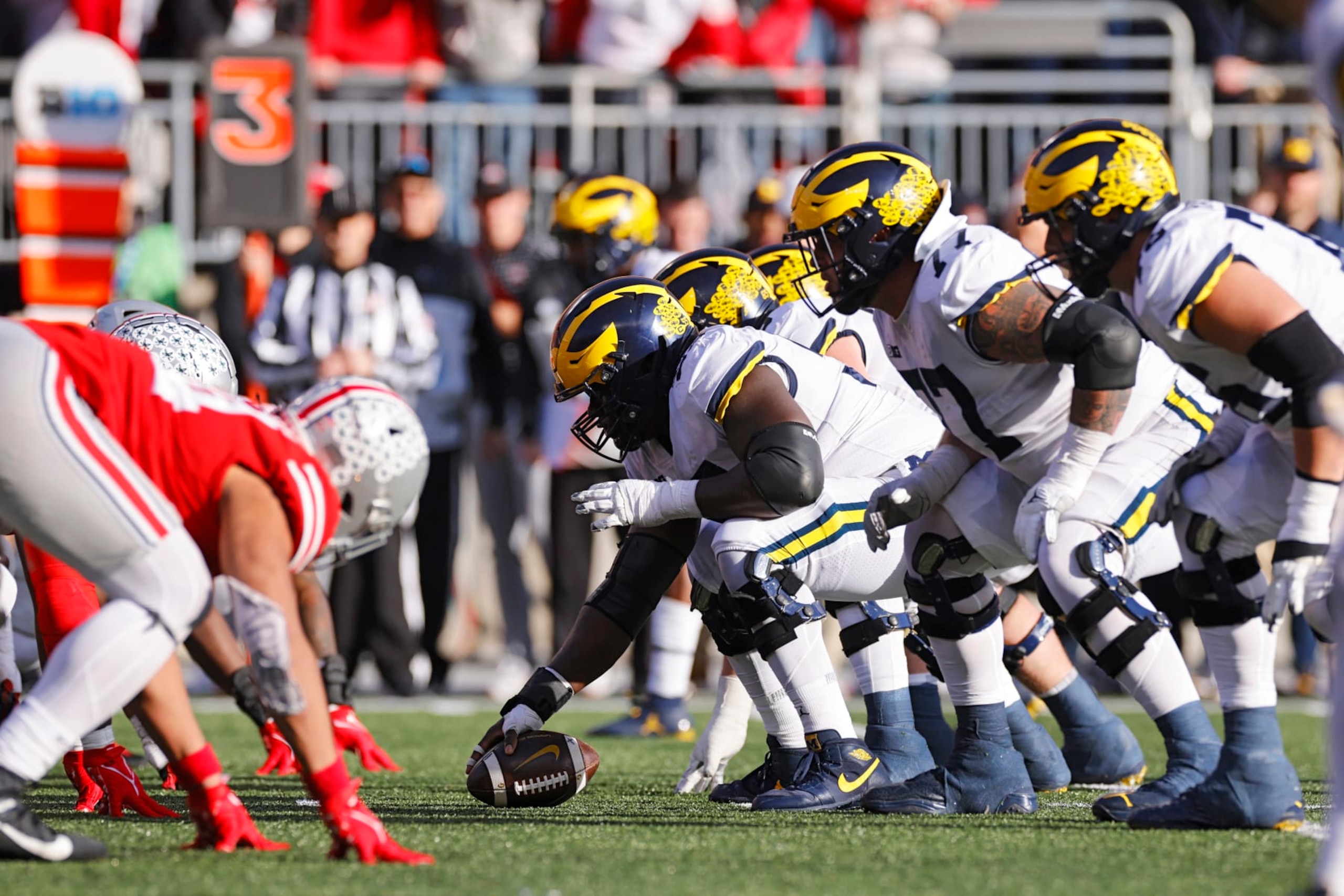 COLUMBUS, OH - NOVEMBER 26: Michigan Wolverines and Ohio State Buckeyes players line up at the line of scrimmage before the snap during a college football game on November 26, 2022 at Ohio Stadium in Columbus, Ohio. (Photo by Joe Robbins/Icon Sportswire via Getty Images) COLUMBUS, OH - NOVEMBER 26: Michigan Wolverines and Ohio State Buckeyes players line up at the line of scrimmage before the snap during a college football game on November 26, 2022 at Ohio Stadium in Columbus, Ohio. (Photo by Joe Robbins/Icon Sportswire via Getty Images)