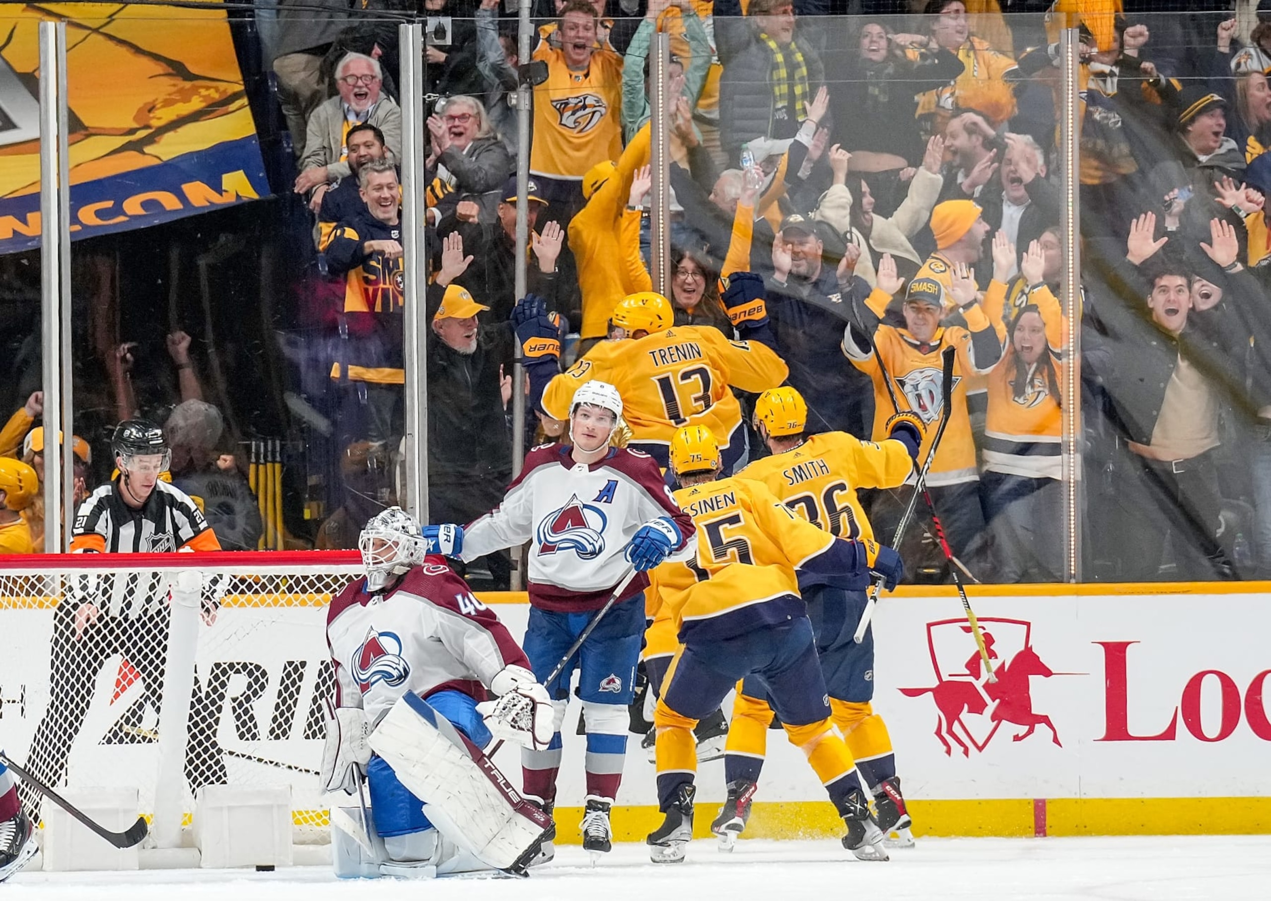 NASHVILLE, TENNESSEE - NOVEMBER 20: Yakov Trenin #13 of the Nashville Predators celebrates his game-winning goal in the last minute of regulation against Alexandar Georgiev #40 and Cale Makar #8 of the Colorado Avalanche during an NHL game at Bridgestone Arena on November 20, 2023 in Nashville, Tennessee. (Photo by John Russell/NHLI via Getty Images)