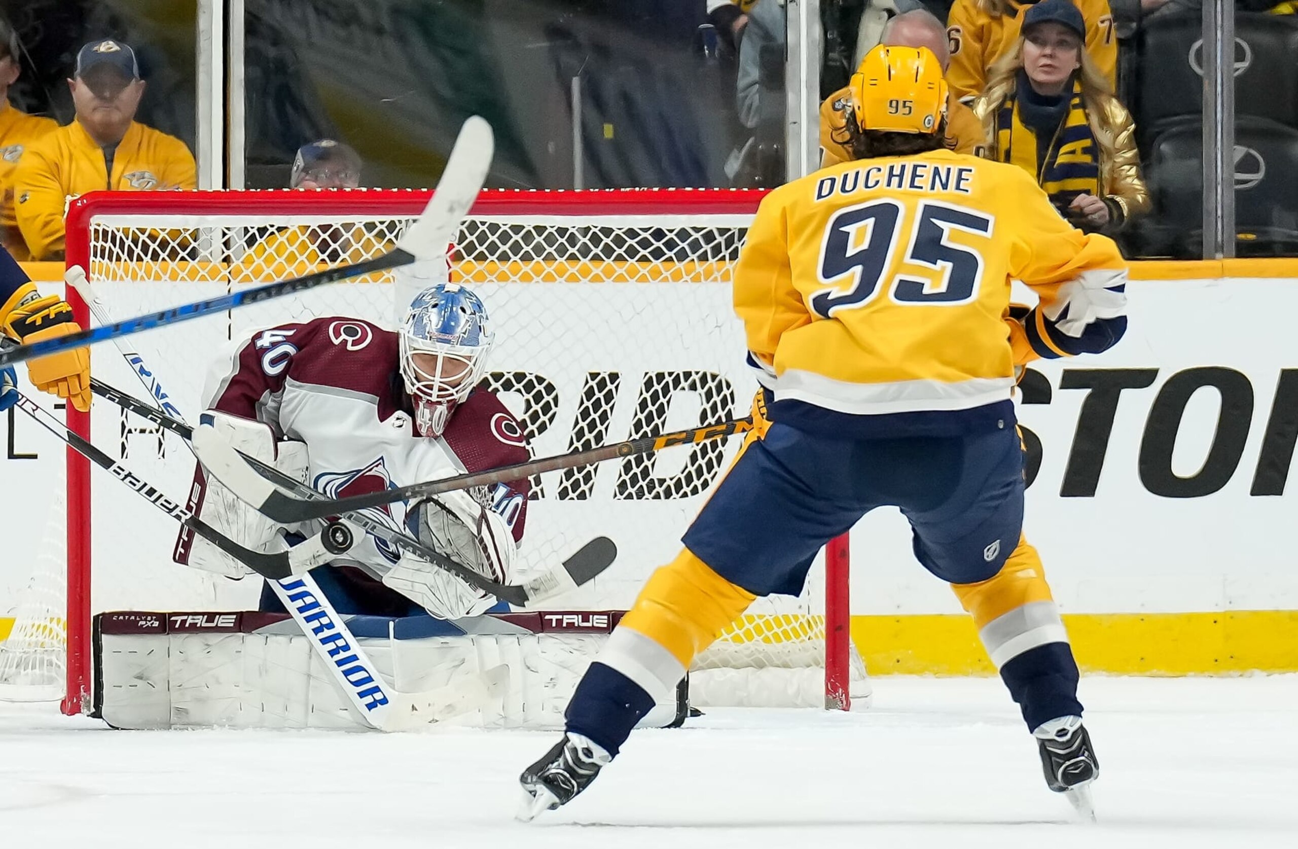 NASHVILLE, TENNESSEE - DECEMBER 23: Alexandar Georgiev #40 of the Colorado Avalanche makes the save against Matt Duchene #95 of the Nashville Predators during an NHL game at Bridgestone Arena on December 23, 2022 in Nashville, Tennessee. (Photo by John Russell/NHLI via Getty Images)