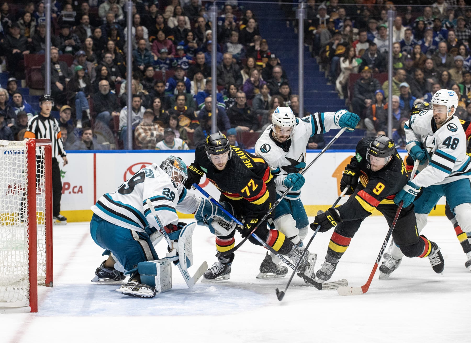VANCOUVER, CANADA - NOVEMBER 20: J.T. Miller #9 of the Vancouver Canucks scores a goal on Mackenzie Blackwood #29 of the San Jose Sharks in the third period of their NHL game at Rogers Arena on November 20, 2023 in Vancouver, British Columbia, Canada. (Photo by Jeff Vinnick/NHLI via Getty Images) VANCOUVER, CANADA - NOVEMBER 20: J.T. Miller #9 of the Vancouver Canucks scores a goal on Mackenzie Blackwood #29 of the San Jose Sharks in the third period of their NHL game at Rogers Arena on November 20, 2023 in Vancouver, British Columbia, Canada. (Photo by Jeff Vinnick/NHLI via Getty Images)