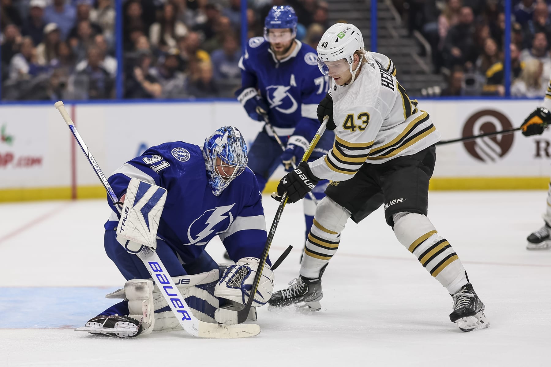 TAMPA, FL - NOVEMBER 20: Goalie Jonas Johansson #31 of the Tampa Bay Lightning against Danton Heinen #43 of the Boston Bruins during the second period at Amalie Arena on November 20, 2023 in Tampa, Florida. (Photo by Mike Carlson/NHLI via Getty Images) TAMPA, FL - NOVEMBER 20: Goalie Jonas Johansson #31 of the Tampa Bay Lightning against Danton Heinen #43 of the Boston Bruins during the second period at Amalie Arena on November 20, 2023 in Tampa, Florida. (Photo by Mike Carlson/NHLI via Getty Images)