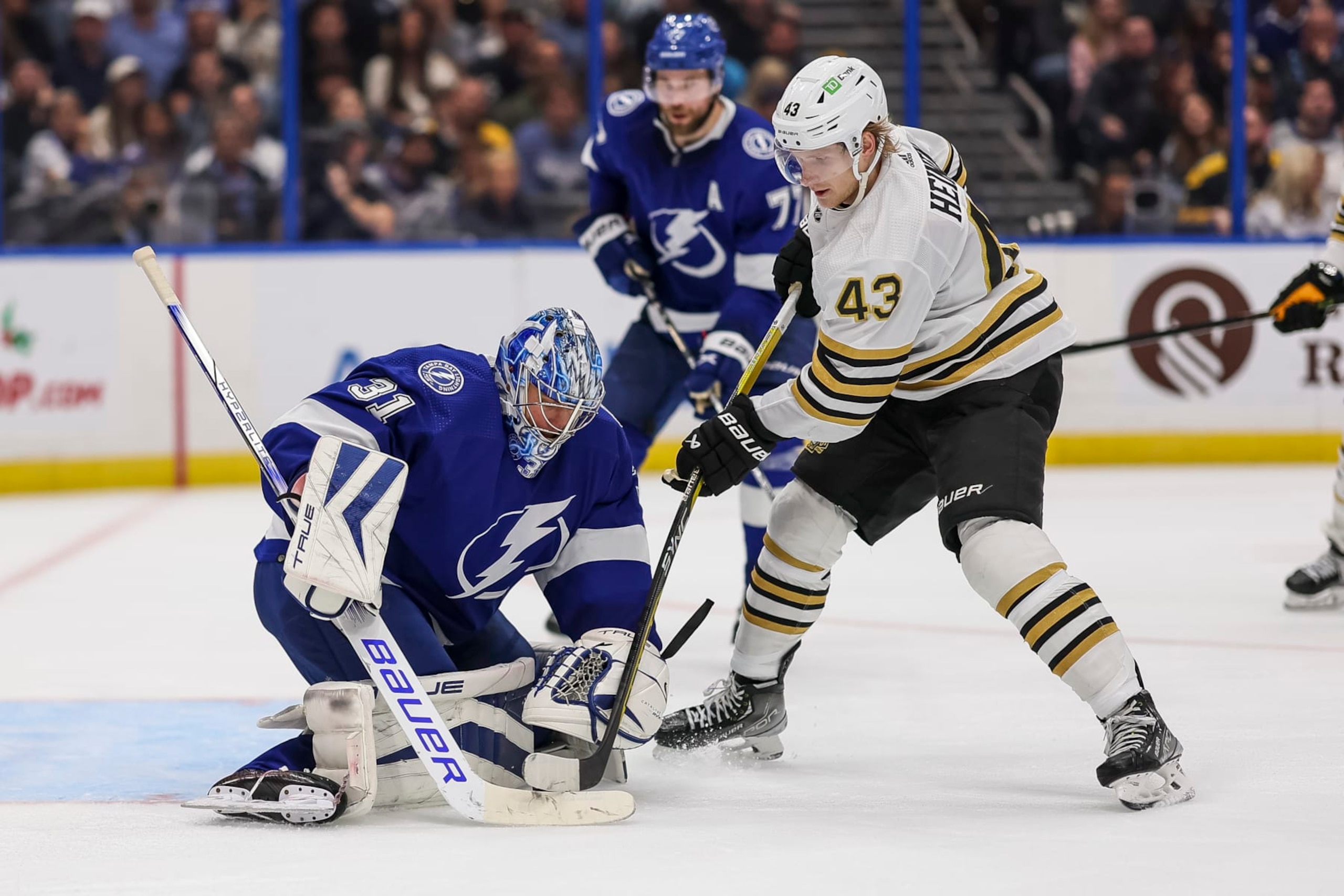 TAMPA, FL - NOVEMBER 20: Goalie Jonas Johansson #31 of the Tampa Bay Lightning against Danton Heinen #43 of the Boston Bruins during the second period at Amalie Arena on November 20, 2023 in Tampa, Florida. (Photo by Mike Carlson/NHLI via Getty Images)