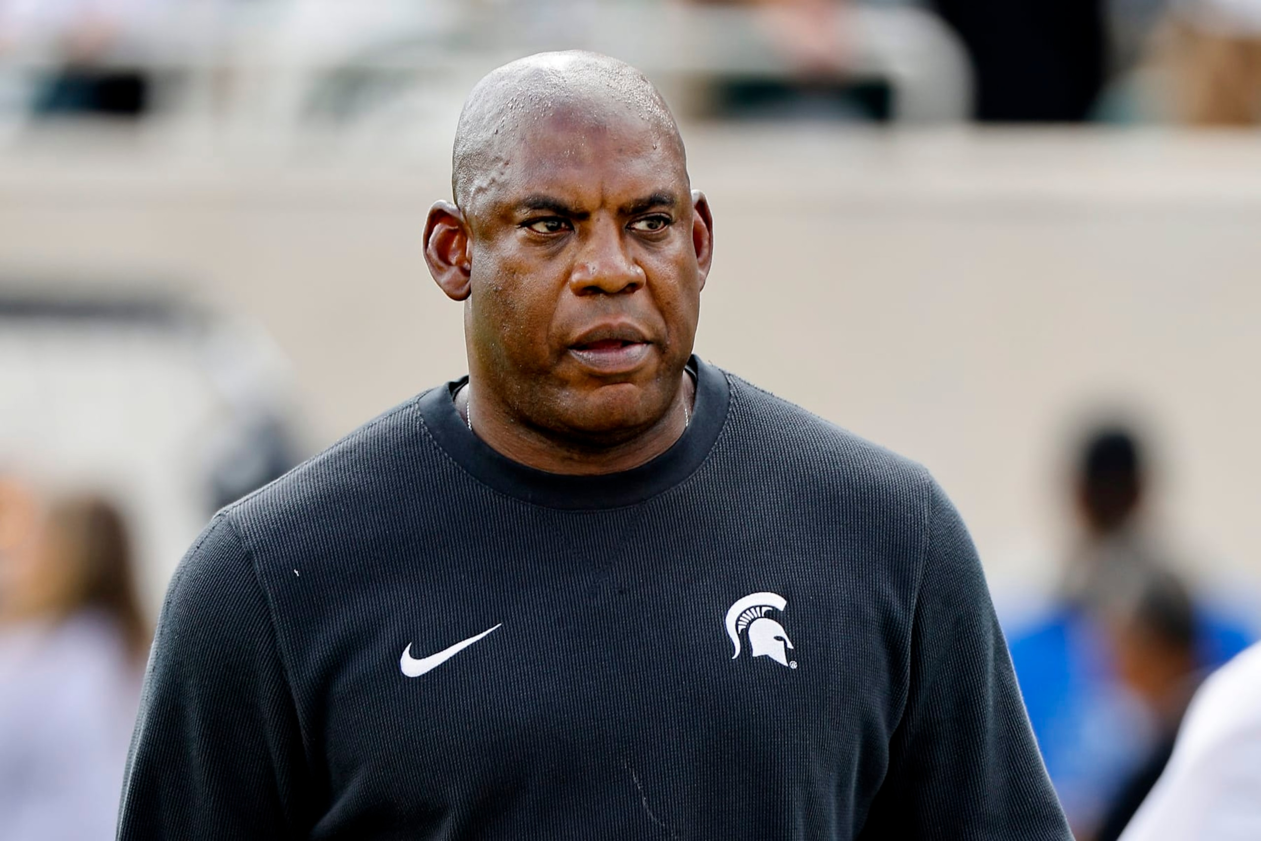 EAST LANSING, MICHIGAN - SEPTEMBER 09: Mel Tucker head coach of the Michigan State Spartans looks on before a game against the Richmond Spiders at Spartan Stadium on September 09, 2023 in East Lansing, Michigan. (Photo by Mike Mulholland/Getty Images) EAST LANSING, MICHIGAN - SEPTEMBER 09: Mel Tucker head coach of the Michigan State Spartans looks on before a game against the Richmond Spiders at Spartan Stadium on September 09, 2023 in East Lansing, Michigan. (Photo by Mike Mulholland/Getty Images)
