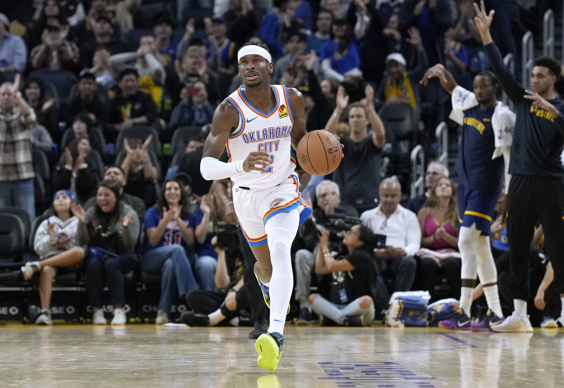 SAN FRANCISCO, CALIFORNIA - NOVEMBER 18: Shai Gilgeous-Alexander #2 of the Oklahoma City Thunder dribbles the ball up court against the Golden State Warriors during the first half of an NBA basketball game at Chase Center on November 18, 2023 in San Francisco, California. NOTE TO USER: User expressly acknowledges and agrees that, by downloading and or using this photograph, User is consenting to the terms and conditions of the Getty Images License Agreement. (Photo by Thearon W. Henderson/Getty Images)
