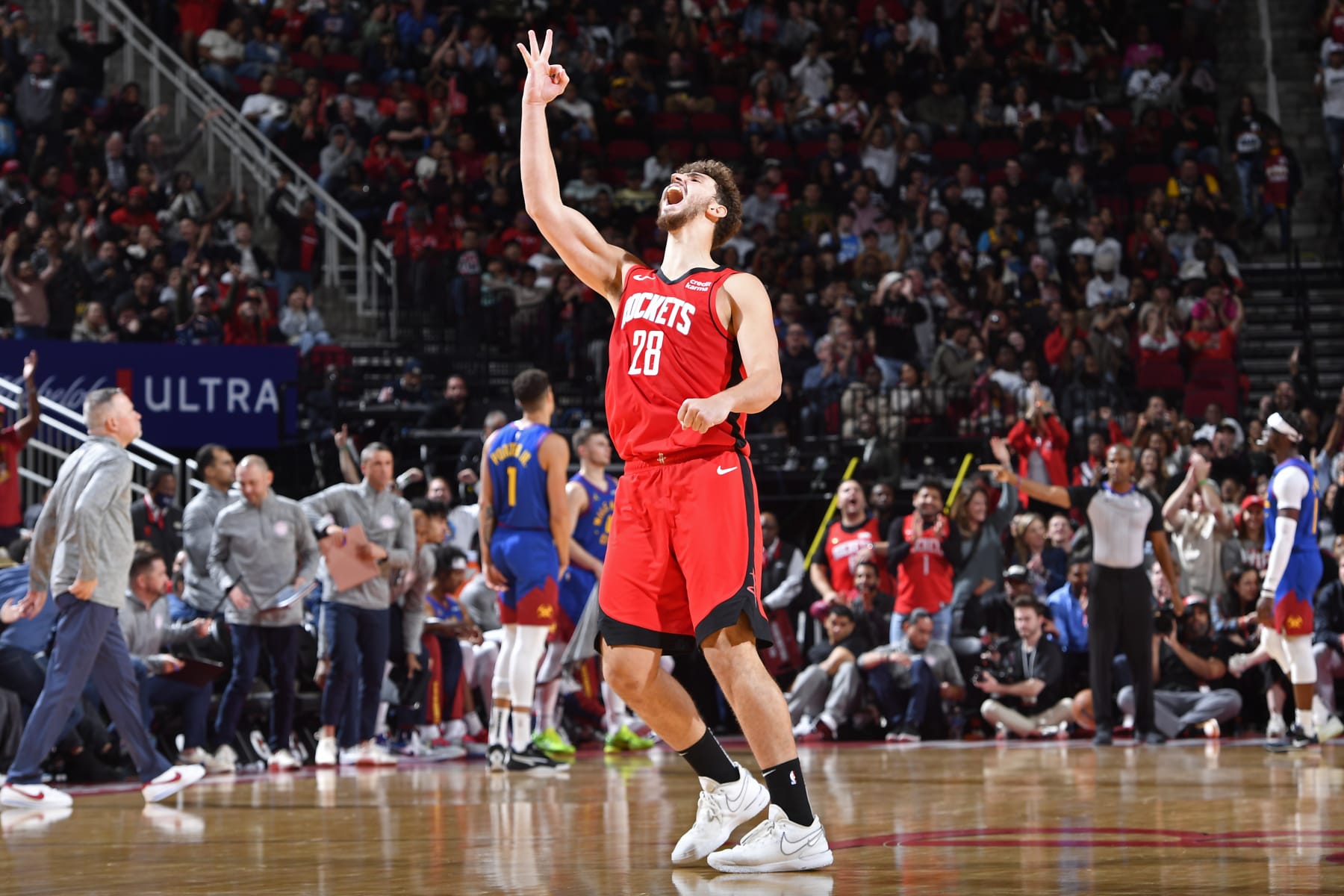 HOUSTON, TX - NOVEMBER 12:  Alperen Sengun #28 of the Houston Rockets celebrates after three point basket during the game against the Denver Nuggets on November 12, 2023 at the Toyota Center in Houston, Texas. NOTE TO USER: User expressly acknowledges and agrees that, by downloading and or using this photograph, User is consenting to the terms and conditions of the Getty Images License Agreement. Mandatory Copyright Notice: Copyright 2023 NBAE (Photo by Logan Riely/NBAE via Getty Images)