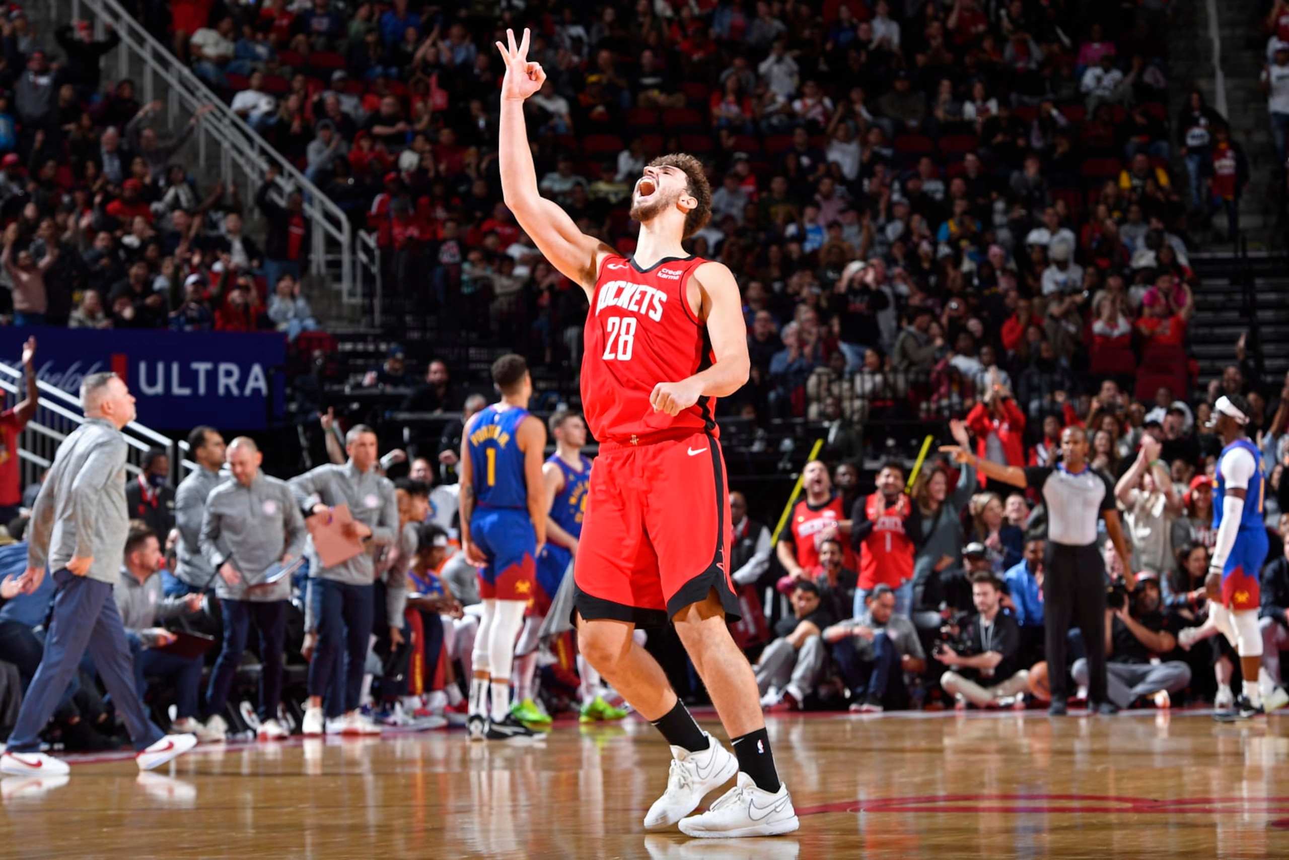 HOUSTON, TX - NOVEMBER 12:  Alperen Sengun #28 of the Houston Rockets celebrates after three point basket during the game against the Denver Nuggets on November 12, 2023 at the Toyota Center in Houston, Texas. NOTE TO USER: User expressly acknowledges and agrees that, by downloading and or using this photograph, User is consenting to the terms and conditions of the Getty Images License Agreement. Mandatory Copyright Notice: Copyright 2023 NBAE (Photo by Logan Riely/NBAE via Getty Images)