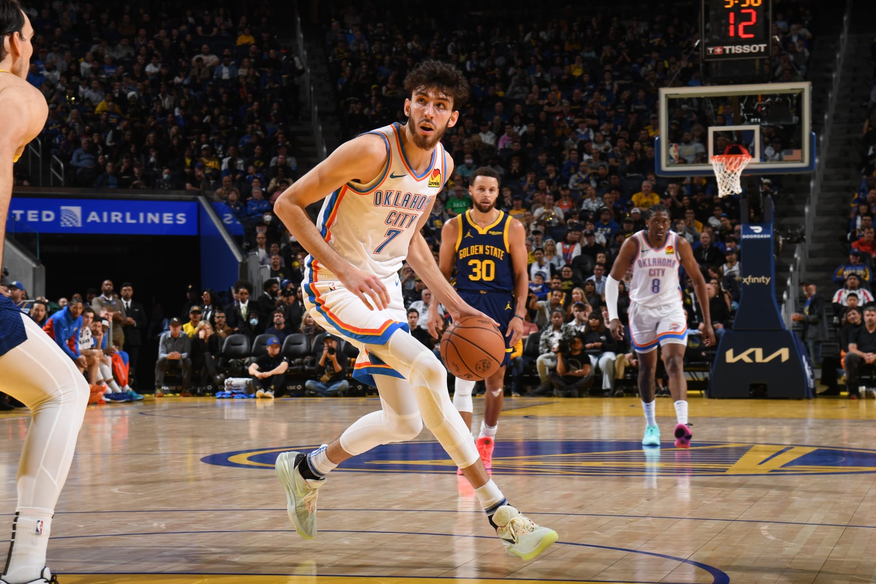 SAN FRANCISCO, CA - NOVEMBER 18: Chet Holmgren #7 of the Oklahoma City Thunder dribbles the ball during the game against the Golden State Warriors on November 18, 2023 at Chase Center in San Francisco, California. NOTE TO USER: User expressly acknowledges and agrees that, by downloading and or using this photograph, user is consenting to the terms and conditions of Getty Images License Agreement. Mandatory Copyright Notice: Copyright 2023 NBAE (Photo by Noah Graham/NBAE via Getty Images)