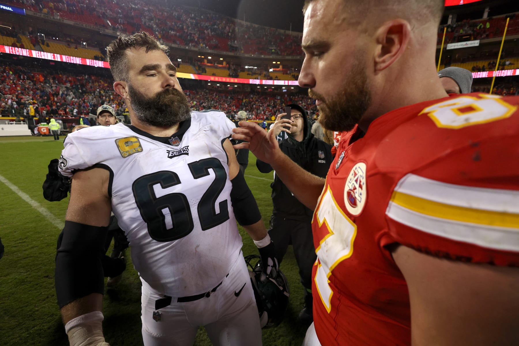 KANSAS CITY, MISSOURI - NOVEMBER 20: Jason Kelce #62 of the Philadelphia Eagles talks to brother Travis Kelce #87 of the Kansas City Chiefs after their game at GEHA Field at Arrowhead Stadium on November 20, 2023 in Kansas City, Missouri. (Photo by Jamie Squire/Getty Images)