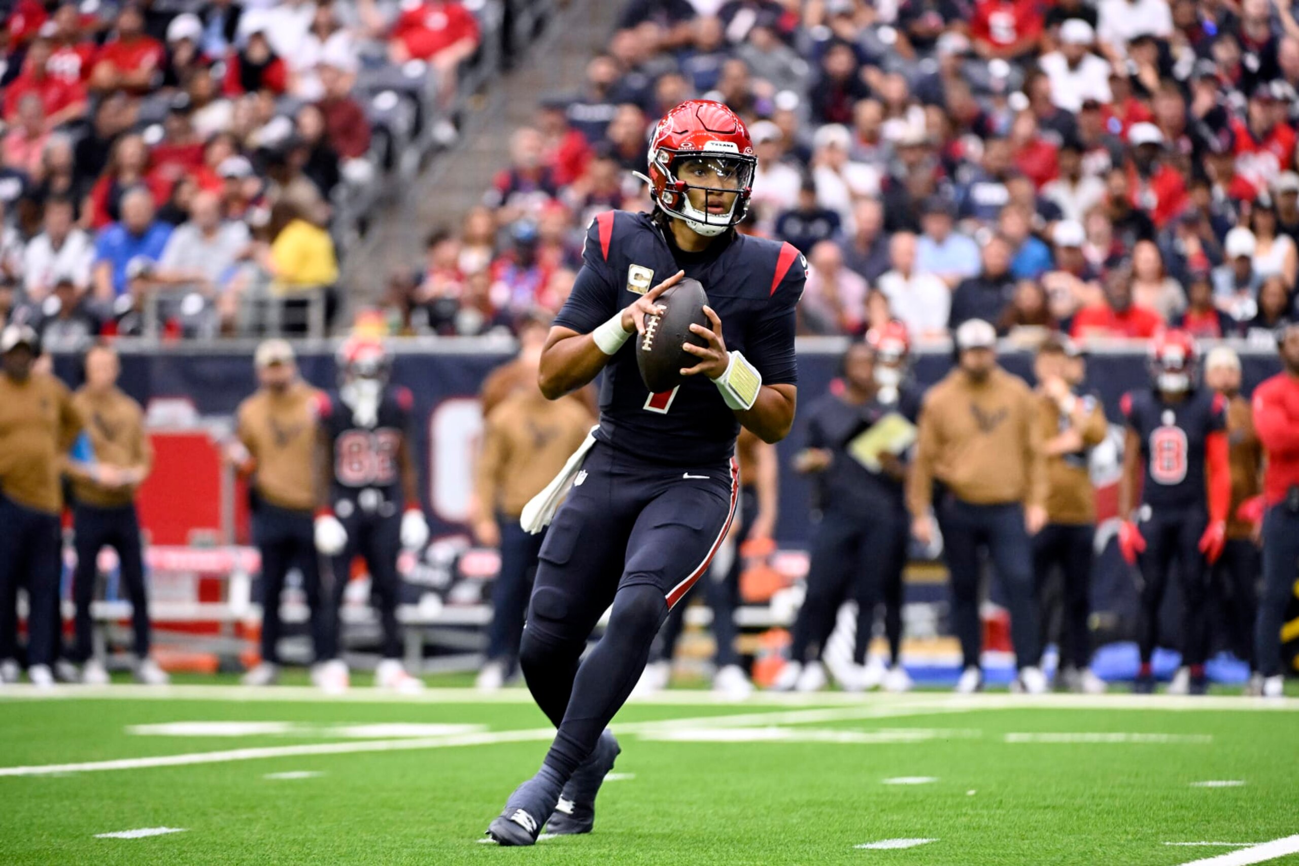 HOUSTON, TEXAS - NOVEMBER 19: C.J. Stroud #7 of the Houston Texans looks to pass during the first half of a game against the Arizona Cardinals at NRG Stadium on November 19, 2023 in Houston, Texas. (Photo by Logan Riely/Getty Images)