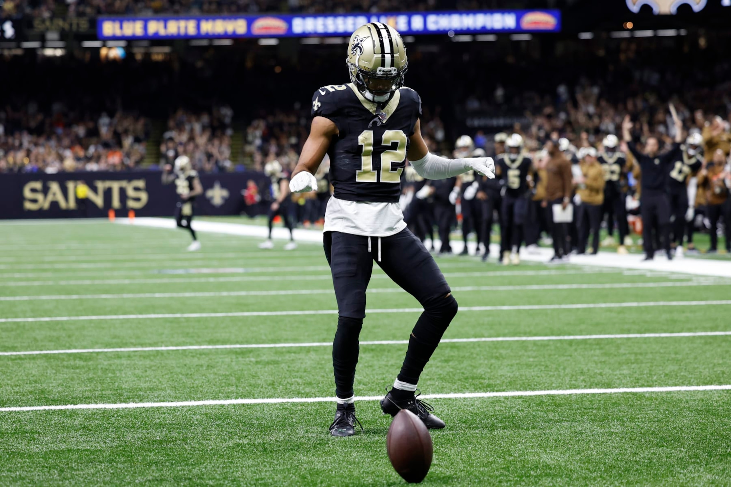NEW ORLEANS, LOUISIANA - NOVEMBER 05: Chris Olave #12 of the New Orleans Saints celebrates after a touchdown during the first quarter in the game against the Chicago Bears at Caesars Superdome on November 05, 2023 in New Orleans, Louisiana. (Photo by Wesley Hitt/Getty Images)