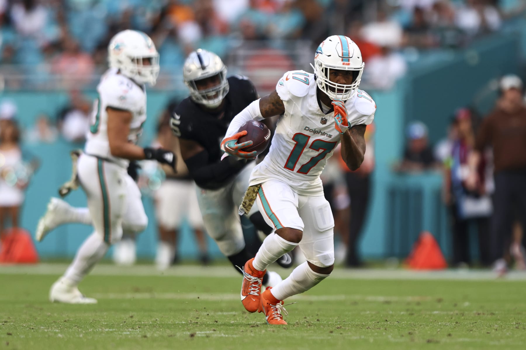 MIAMI GARDENS, FL - NOVEMBER 19: Jaylen Waddle #17 of the Miami Dolphins carries the ball during the third quarter of an NFL football game against the Las Vegas Raiders at Hard Rock Stadium on November 19, 2023 in Miami Gardens, Florida. (Photo by Kevin Sabitus/Getty Images)