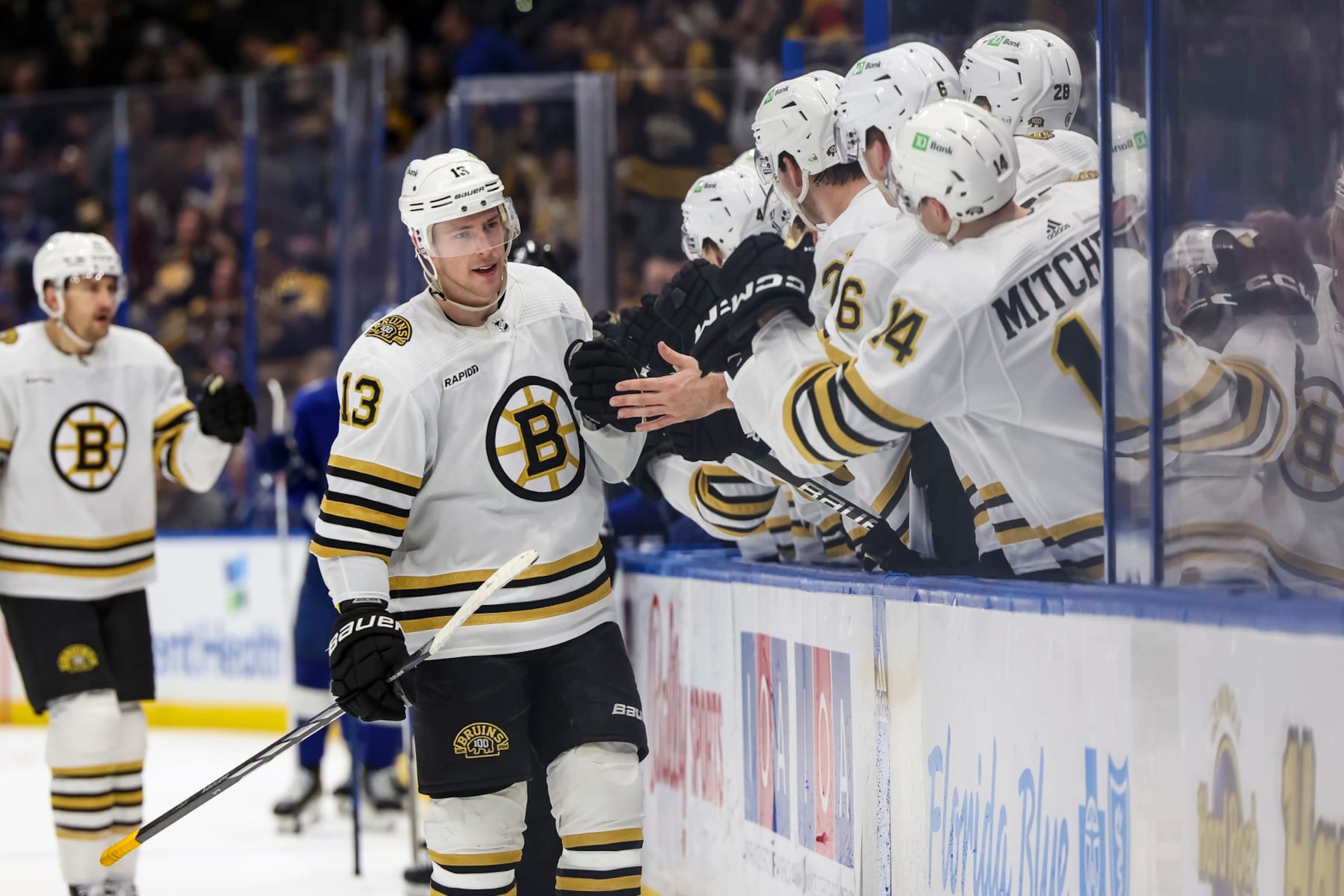 TAMPA, FL - NOVEMBER 20: Charlie Coyle #13 of the Boston Bruins celebrates a goal against the Tampa Bay Lightning during the third period at Amalie Arena on November 20, 2023 in Tampa, Florida. (Photo by Mark LoMoglio/NHLI via Getty Images)