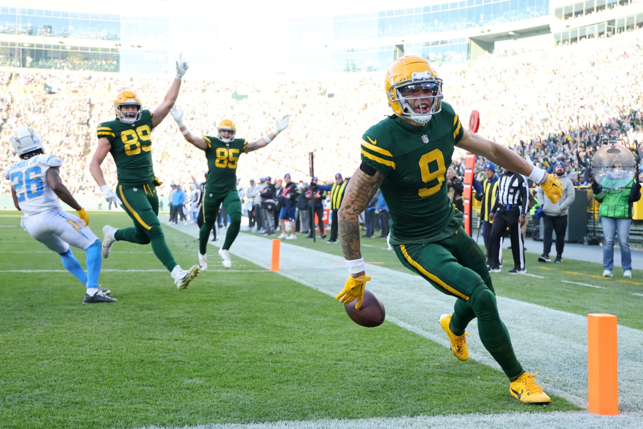 GREEN BAY, WISCONSIN - NOVEMBER 19: Christian Watson #9 of the Green Bay Packers scores a touchdown in the third quarter against the Los Angeles Chargers at Lambeau Field on November 19, 2023 in Green Bay, Wisconsin. (Photo by Stacy Revere/Getty Images) GREEN BAY, WISCONSIN - NOVEMBER 19: Christian Watson #9 of the Green Bay Packers scores a touchdown in the third quarter against the Los Angeles Chargers at Lambeau Field on November 19, 2023 in Green Bay, Wisconsin. (Photo by Stacy Revere/Getty Images)
