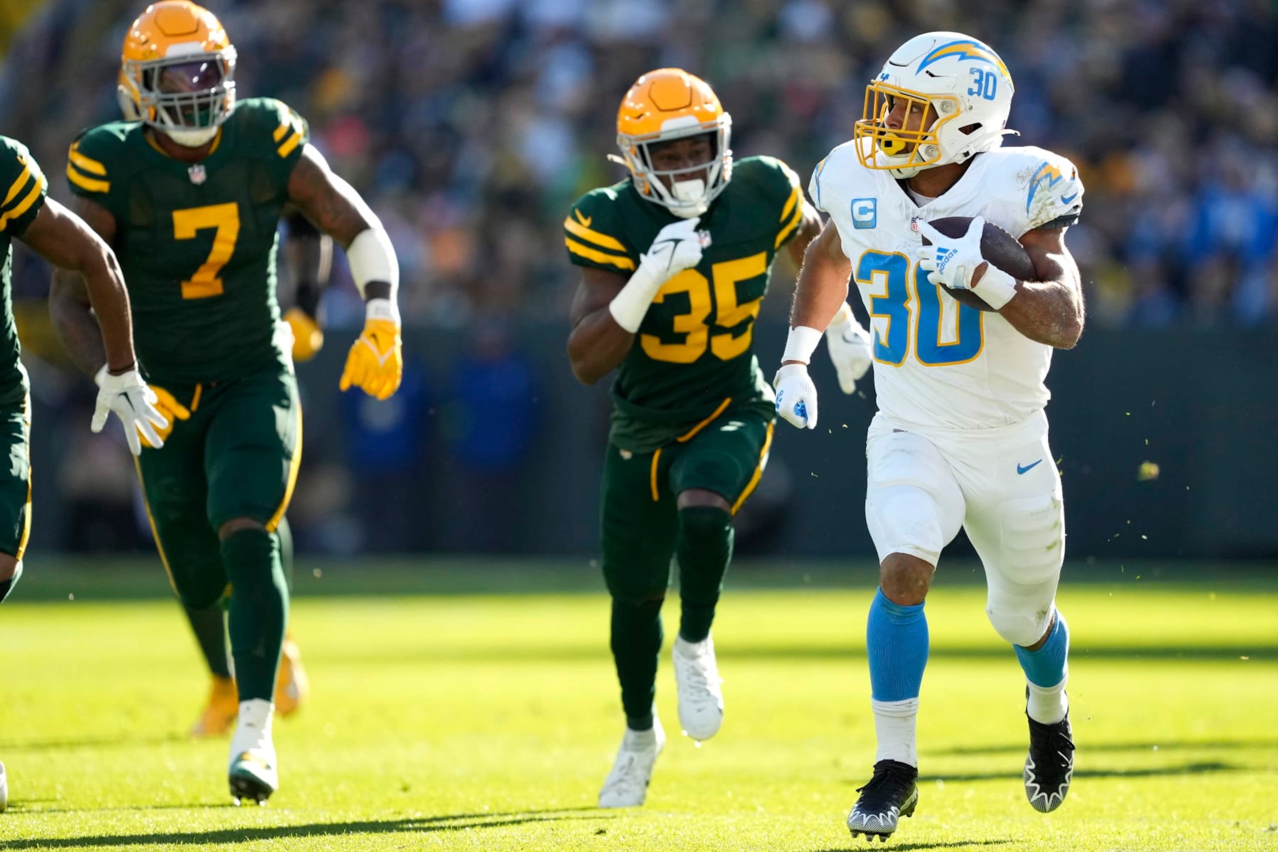 GREEN BAY, WISCONSIN - NOVEMBER 19: Austin Ekeler #30 of the Los Angeles Chargers runs with the ball in the first quarter against the Green Bay Packers at Lambeau Field on November 19, 2023 in Green Bay, Wisconsin. (Photo by Patrick McDermott/Getty Images) GREEN BAY, WISCONSIN - NOVEMBER 19: Austin Ekeler #30 of the Los Angeles Chargers runs with the ball in the first quarter against the Green Bay Packers at Lambeau Field on November 19, 2023 in Green Bay, Wisconsin. (Photo by Patrick McDermott/Getty Images)