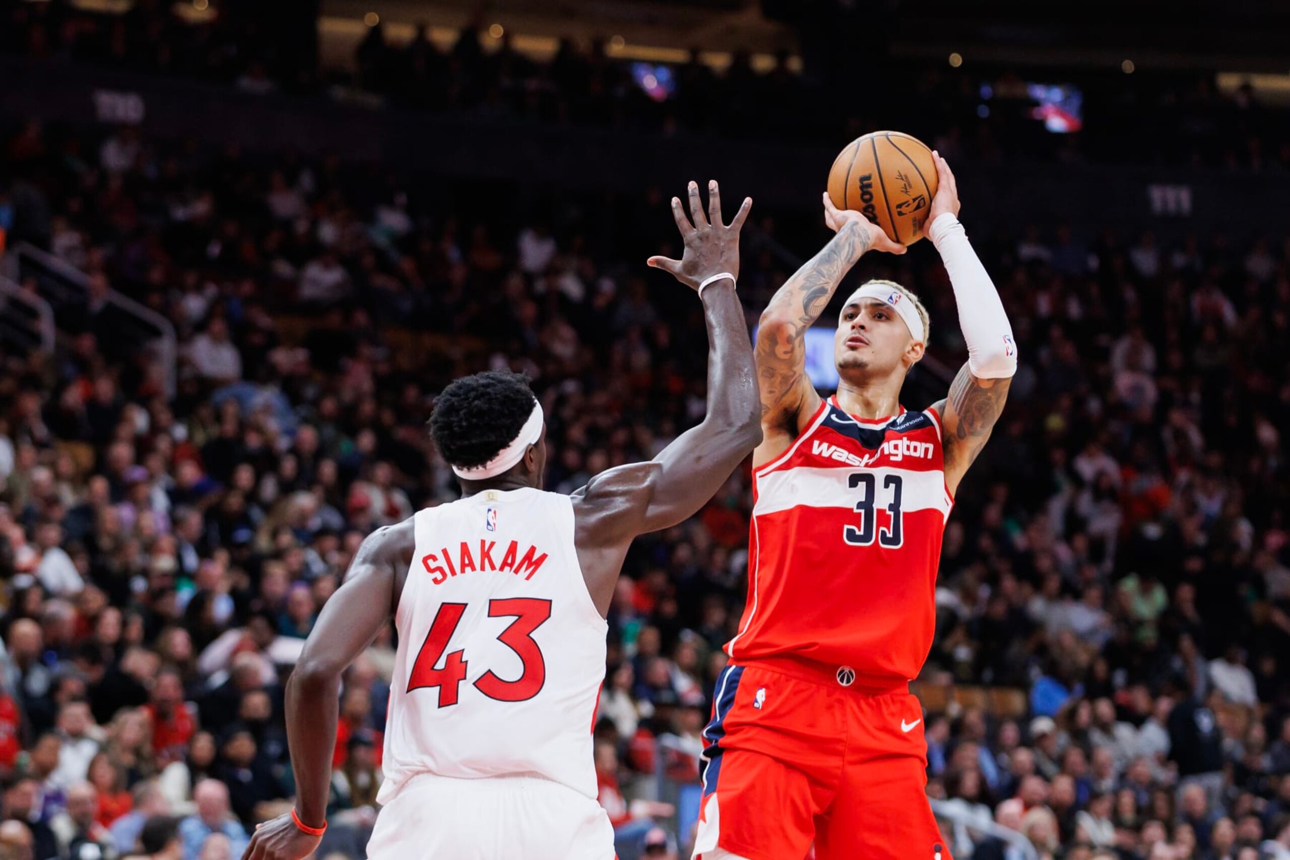 TORONTO, CANADA - NOVEMBER 13: Kyle Kuzma #33 of the Washington Wizards puts up a shot over Pascal Siakam #43 of the Toronto Raptors during the second half of their NBA game at Scotiabank Arena on November 13, 2023 in Toronto, Canada. NOTE TO USER: User expressly acknowledges and agrees that, by downloading and or using this photograph, User is consenting to the terms and conditions of the Getty Images License Agreement. (Photo by Cole Burston/Getty Images)