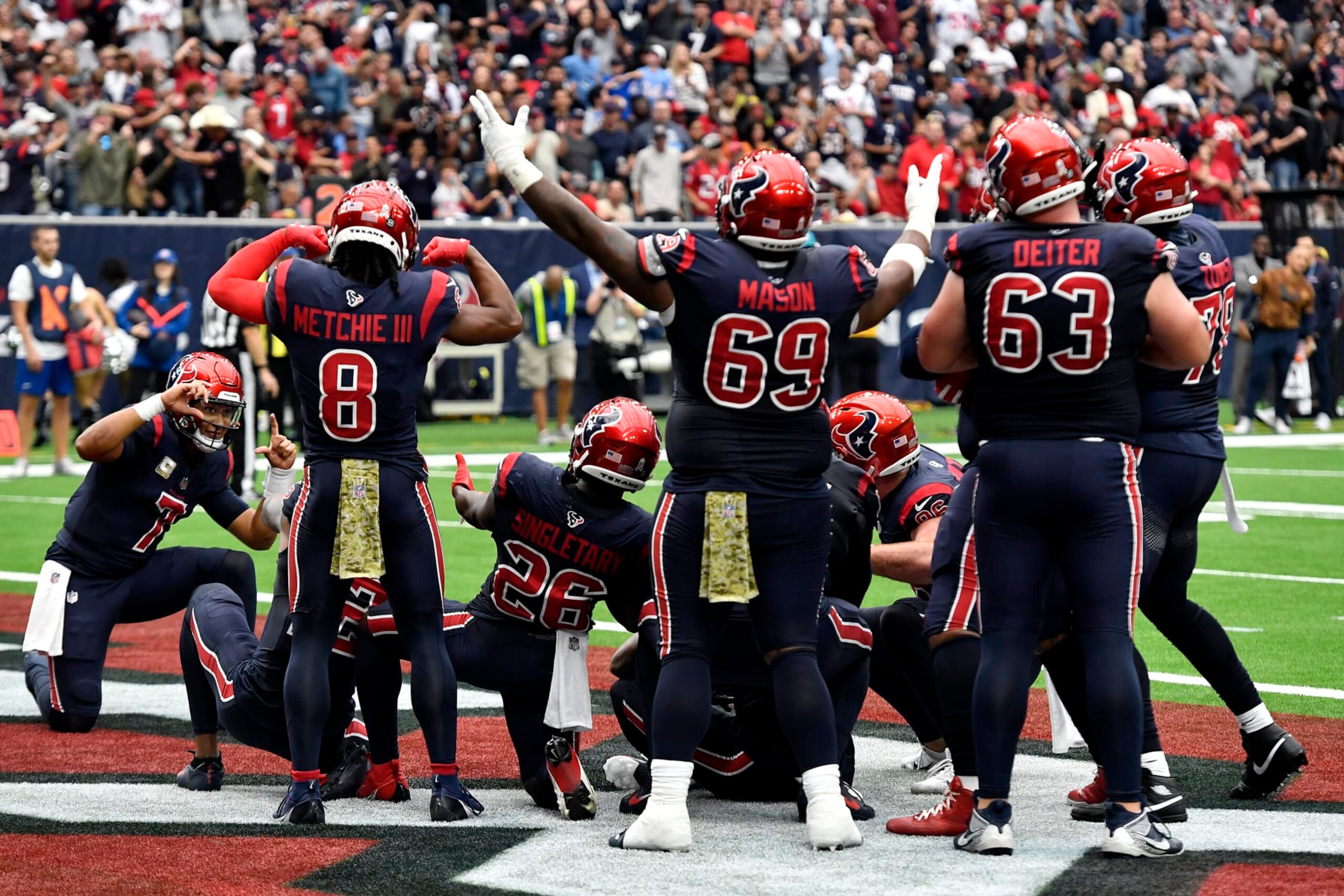 HOUSTON, TEXAS - NOVEMBER 19: C.J. Stroud #7 of the Houston Texans celebrates with the team after a second quarter touchdown during a game against the Arizona Cardinals at NRG Stadium on November 19, 2023 in Houston, Texas. (Photo by Logan Riely/Getty Images) HOUSTON, TEXAS - NOVEMBER 19: C.J. Stroud #7 of the Houston Texans celebrates with the team after a second quarter touchdown during a game against the Arizona Cardinals at NRG Stadium on November 19, 2023 in Houston, Texas. (Photo by Logan Riely/Getty Images)