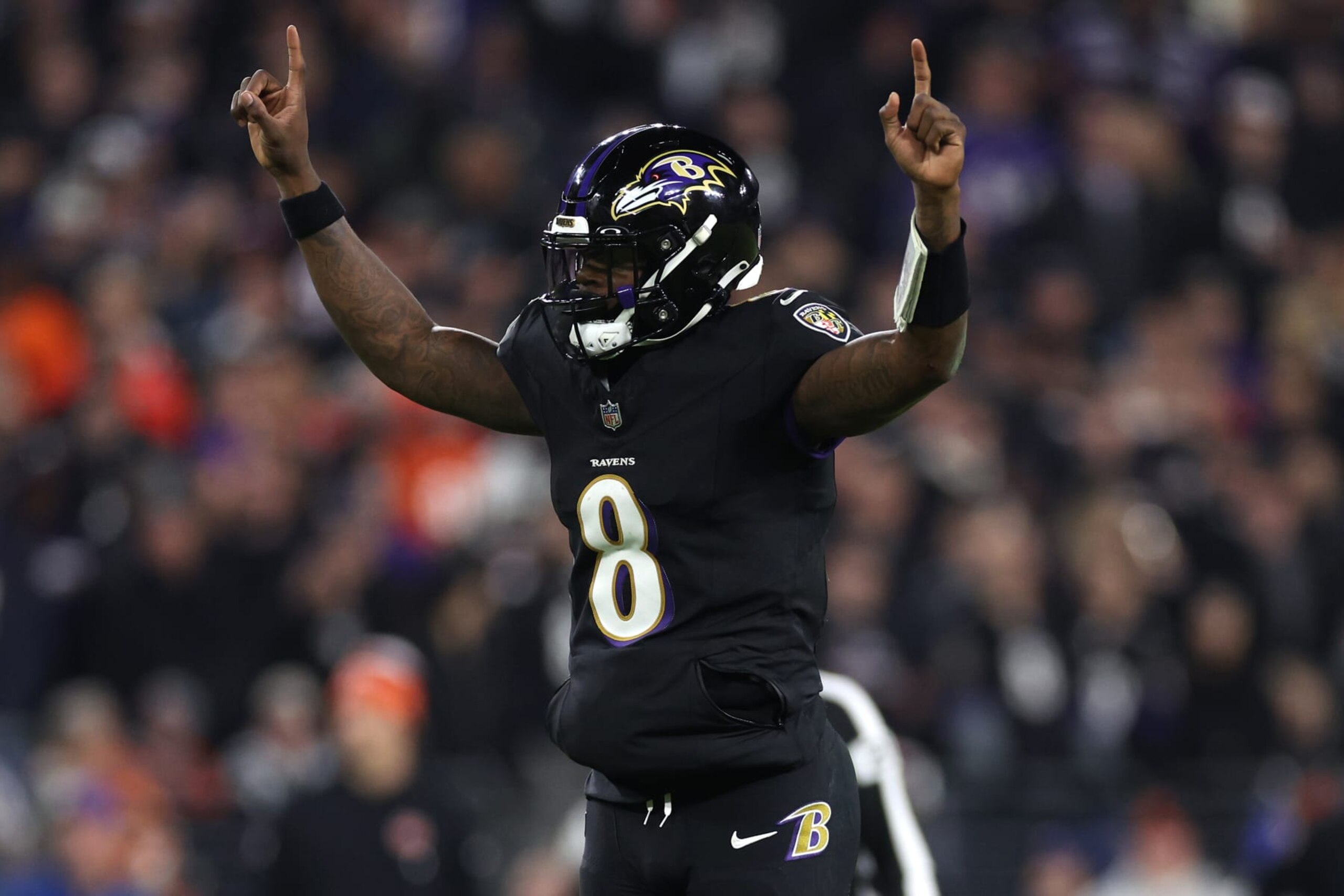 BALTIMORE, MARYLAND - NOVEMBER 16: Lamar Jackson #8 of the Baltimore Ravens celebrates a touchdown scored by Gus Edwards #35 against the Cincinnati Bengals during the fourth quarter of the game at M&T Bank Stadium on November 16, 2023 in Baltimore, Maryland. (Photo by Patrick Smith/Getty Images)