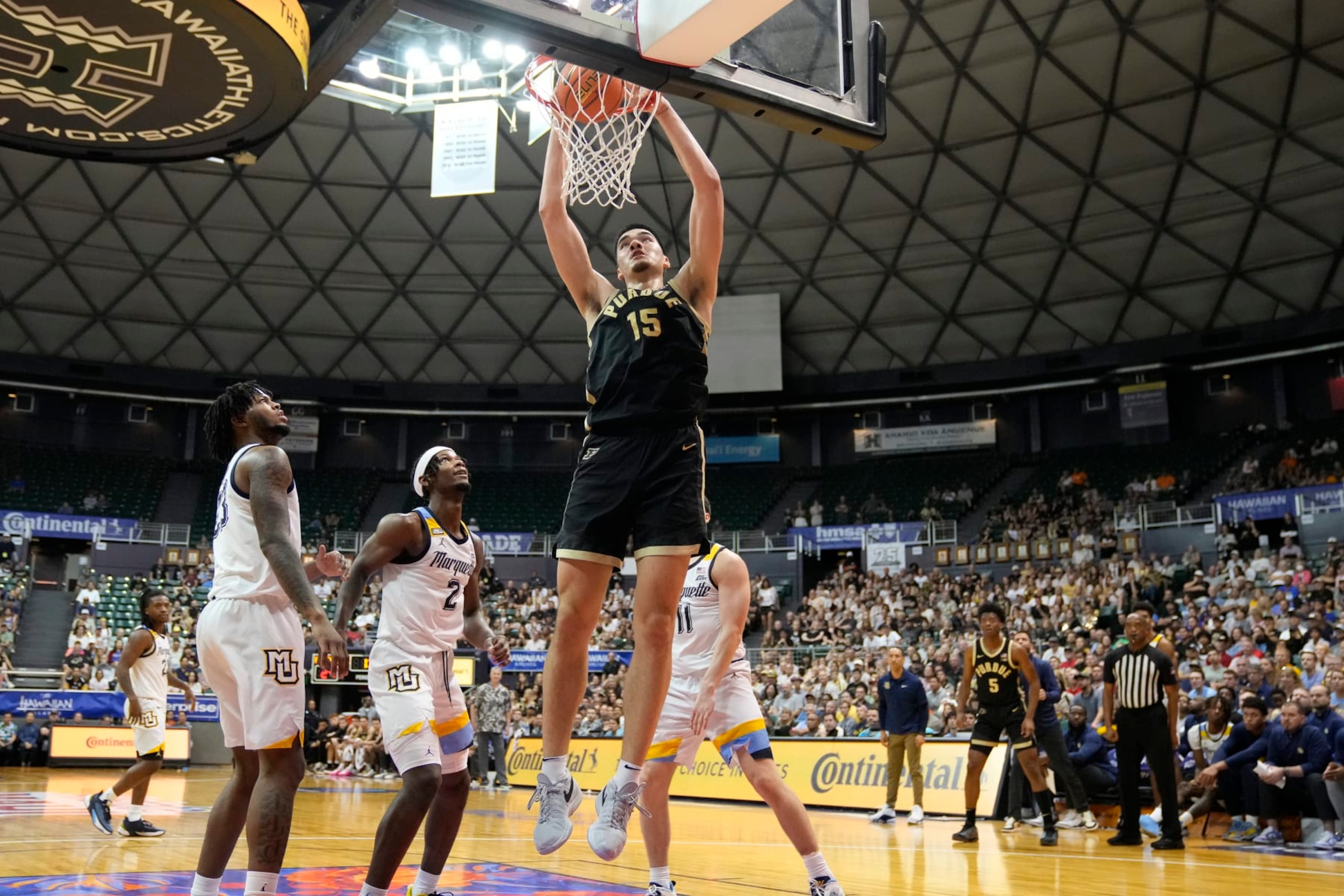 HONOLULU, HI - NOVEMBER 22:  Zach Edey #15 of the Purdue Boilermakers dunks the ball in the first half of a college basketball game against the Marquette Golden Eagles during the championship game of the Allstate Maui Invitational at the SimpliFi Arena at Stan Sheriff Center on November 22, 2023 in Honolulu, Hawaii.  (Photo by Mitchell Layton/Getty Images)