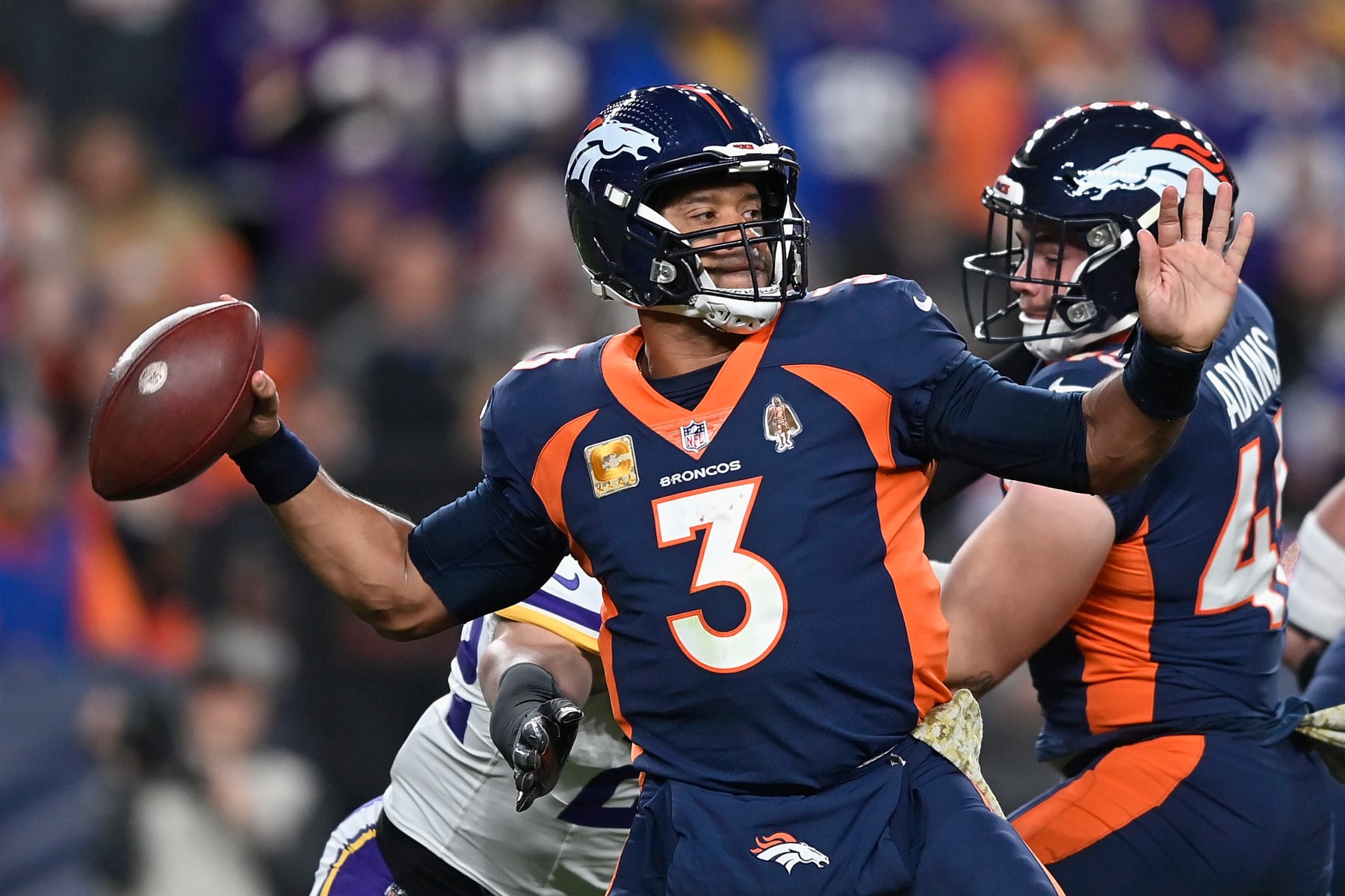 DENVER, COLORADO - NOVEMBER 19: Quarterback Russell Wilson #3 of the Denver Broncos throws a deep pass during the second quarter of the NFL game against the Minnesota Vikings at Empower Field At Mile High on November 19, 2023 in Denver, Colorado. (Photo by Dustin Bradford/Getty Images)