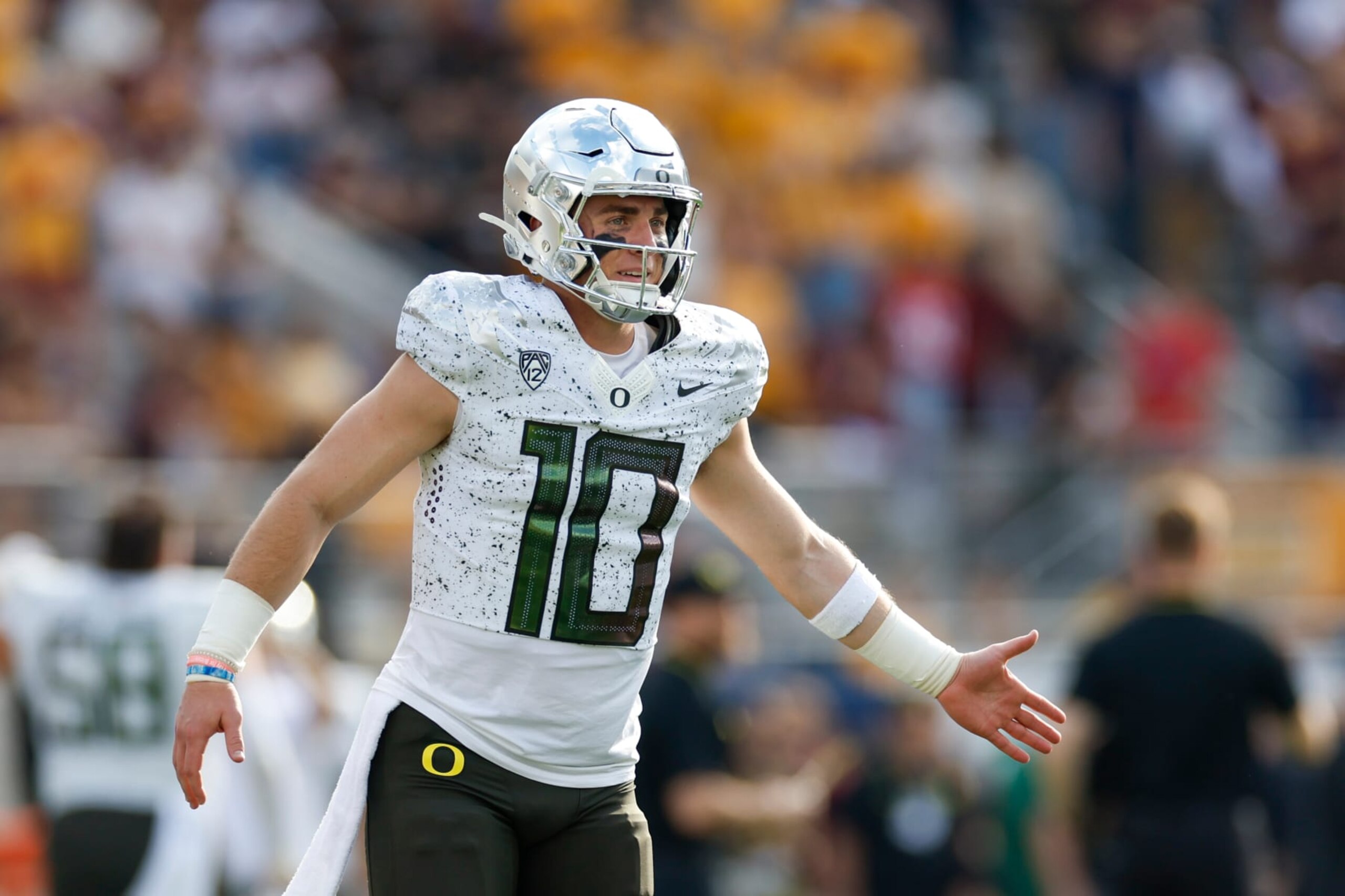 TEMPE, ARIZONA - NOVEMBER 18: Bo Nix #10 of the Oregon Ducks celebrates after throwing a touchdown pass in the first quarter during a game against the Arizona State Sun Devils at Mountain America Stadium on November 18, 2023 in Tempe, Arizona. (Photo by Brandon Sloter/Image Of Sport/Getty Images)
