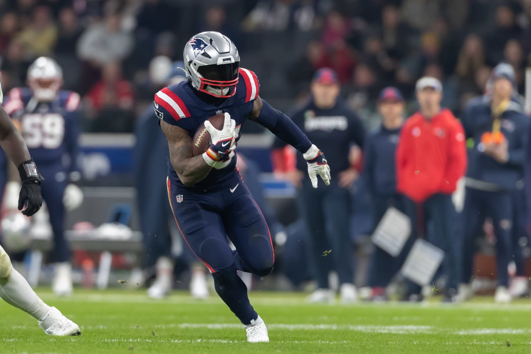 FRANKFURT AM MAIN, GERMANY - NOVEMBER 12: Ezekiel Elliott of New England Patriots controls the ball during the NFL match between Indianapolis Colts and New England Patriots at Deutsche Bank Park on November 12, 2023 in Frankfurt am Main, Germany. (Photo by Mario Hommes/DeFodi Images via Getty Images)