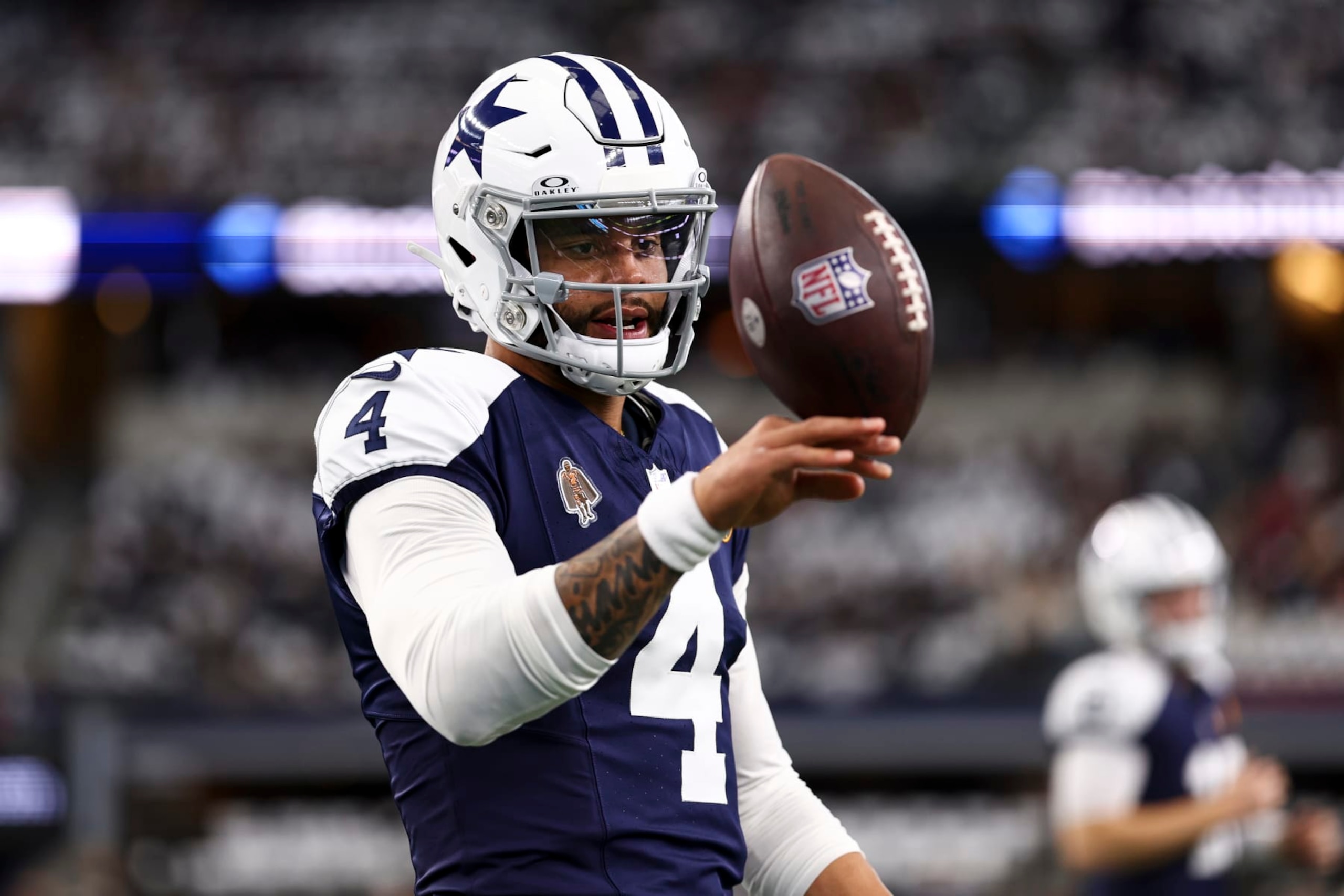 ARLINGTON, TX - NOVEMBER 23: Dak Prescott #4 of the Dallas Cowboys warms up prior to an NFL football game against the Washington Commanders at AT&T Stadium on November 23, 2023 in Arlington, Texas. (Photo by Kevin Sabitus/Getty Images)