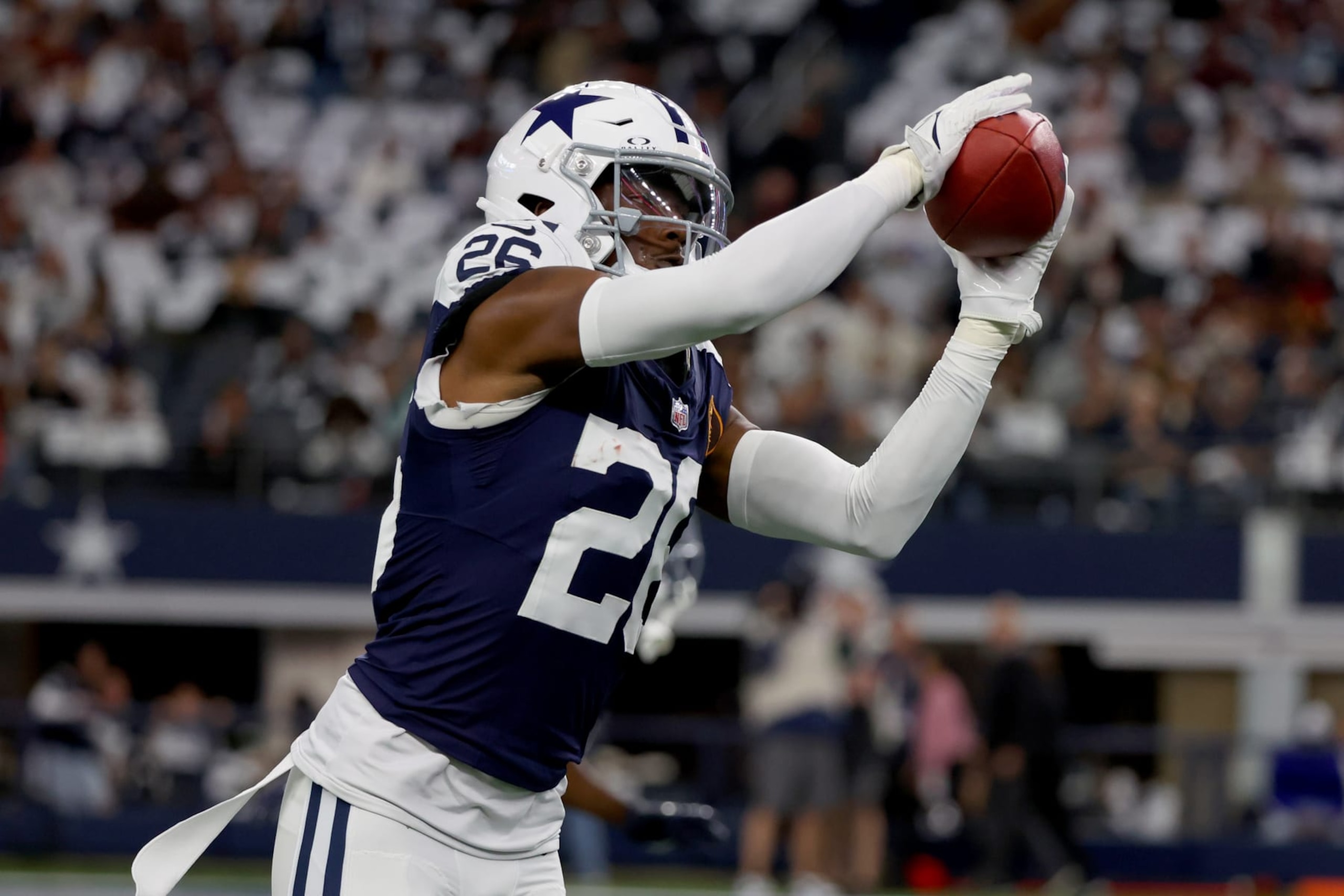 ARLINGTON, TEXAS - NOVEMBER 23: DaRon Bland #26 of the Dallas Cowboys warms up prior to the game against the Washington Commanders at AT&T Stadium on November 23, 2023 in Arlington, Texas. (Photo by Richard Rodriguez/Getty Images)