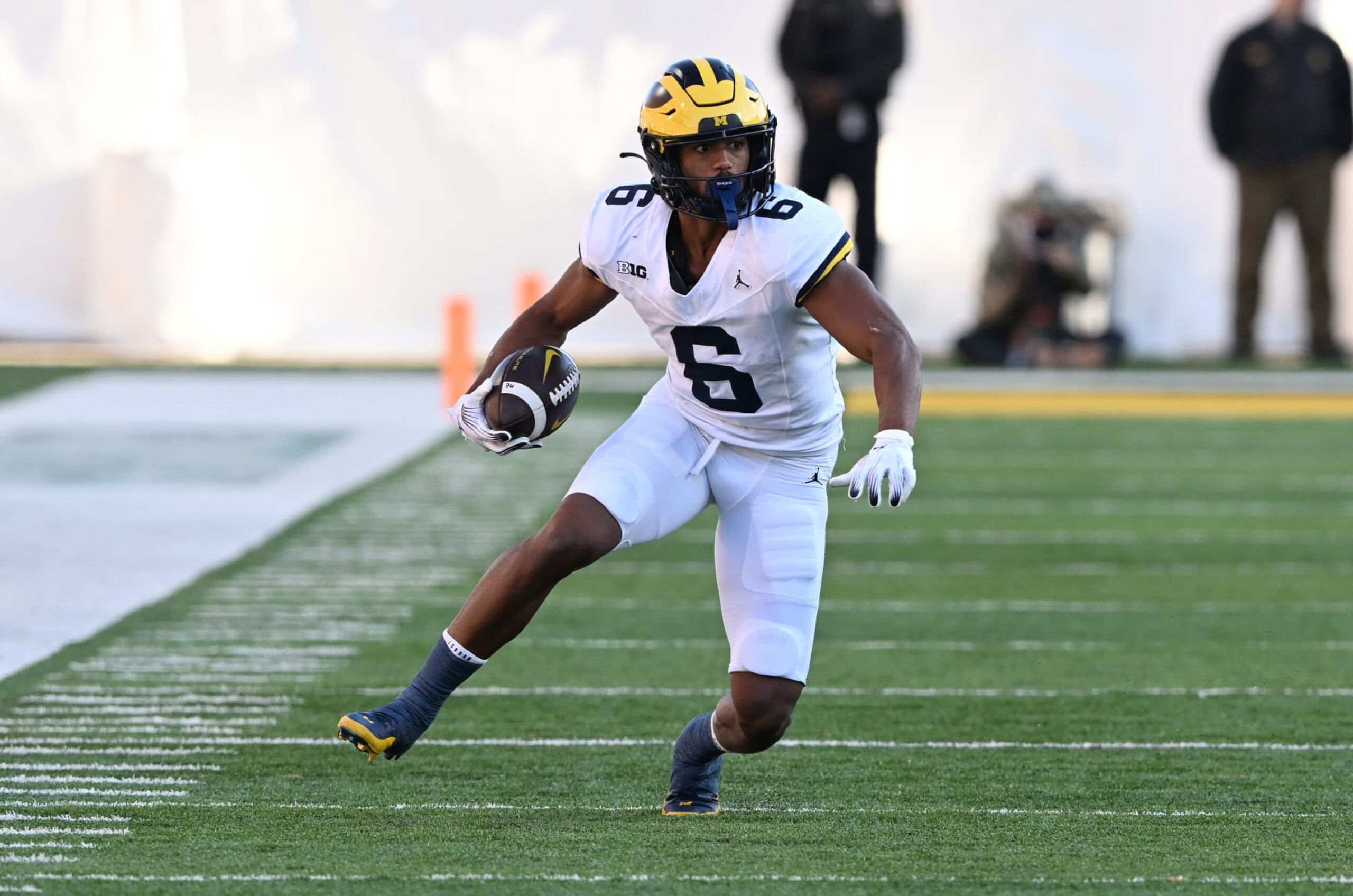 COLLEGE PARK, MARYLAND - NOVEMBER 18: Cornelius Johnson #6 of the Michigan Wolverines runs with the ball against the Maryland Terrapins at SECU Stadium on November 18, 2023 in College Park, Maryland. (Photo by G Fiume/Getty Images) COLLEGE PARK, MARYLAND - NOVEMBER 18: Cornelius Johnson #6 of the Michigan Wolverines runs with the ball against the Maryland Terrapins at SECU Stadium on November 18, 2023 in College Park, Maryland. (Photo by G Fiume/Getty Images)