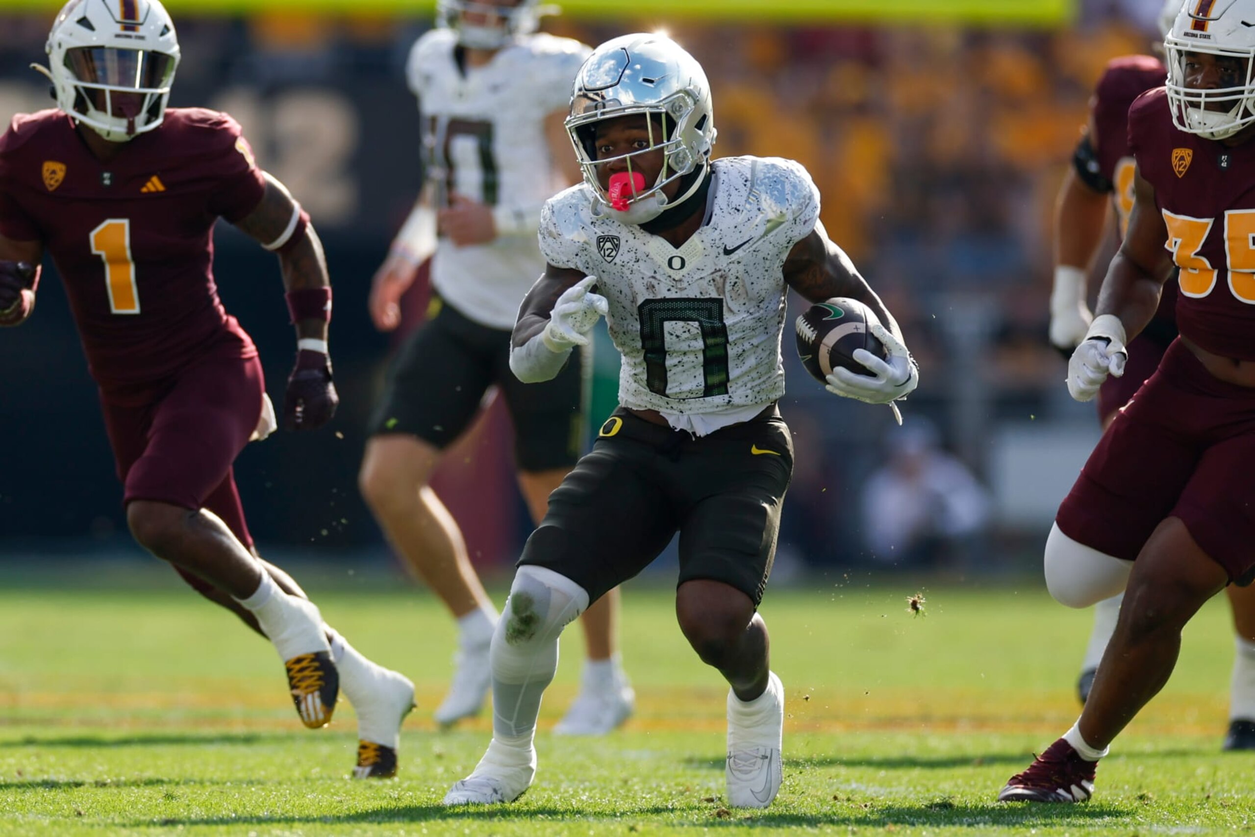 TEMPE, ARIZONA - NOVEMBER 18: Bucky Irving #0 of the Oregon Ducks runs with the ball during a game against the Arizona State Sun Devils at Mountain America Stadium on November 18, 2023 in Tempe, Arizona. (Photo by Brandon Sloter/Image Of Sport/Getty Images) TEMPE, ARIZONA - NOVEMBER 18: Bucky Irving #0 of the Oregon Ducks runs with the ball during a game against the Arizona State Sun Devils at Mountain America Stadium on November 18, 2023 in Tempe, Arizona. (Photo by Brandon Sloter/Image Of Sport/Getty Images)