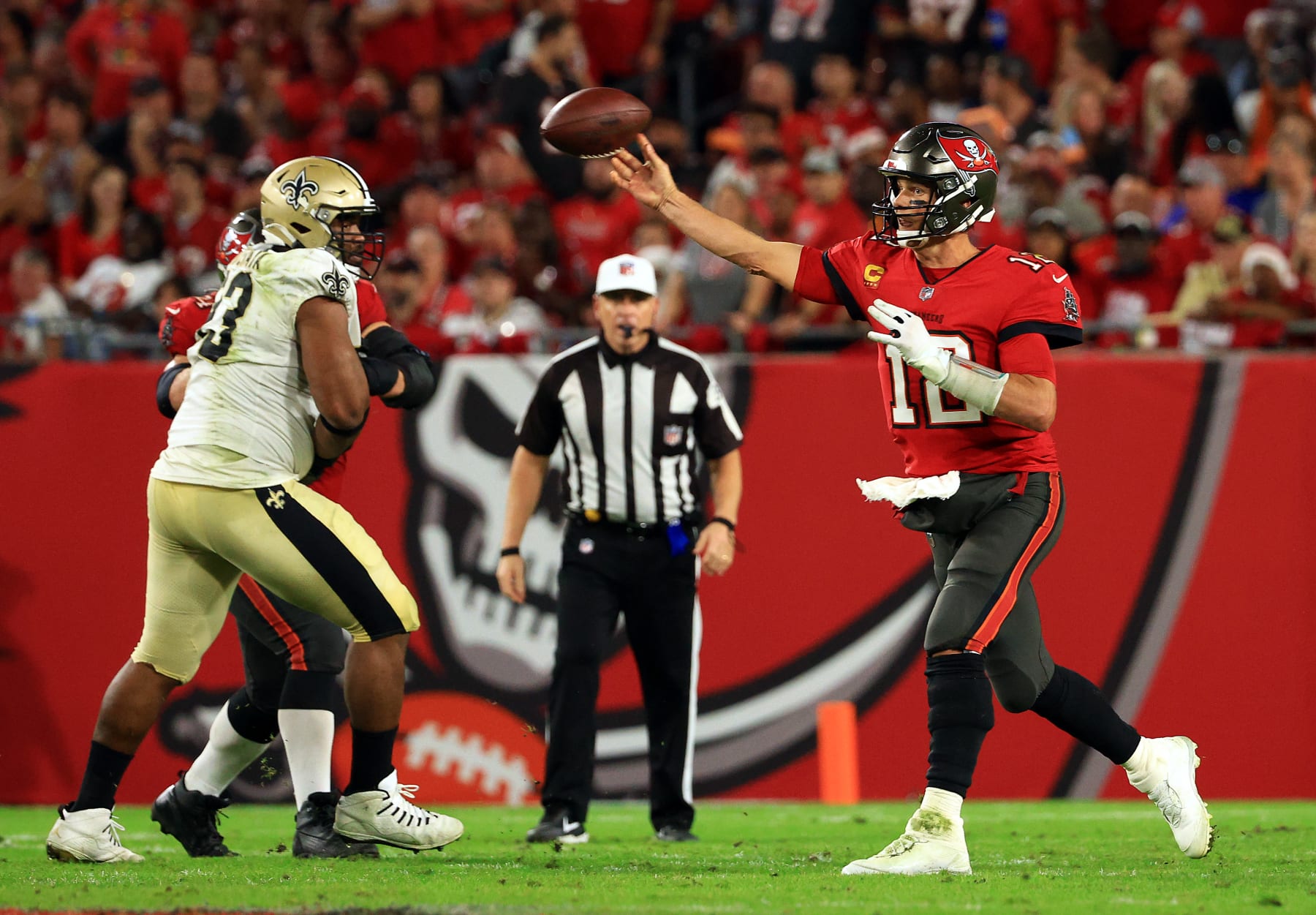 TAMPA, FLORIDA - DECEMBER 19:  Tom Brady #12 of the Tampa Bay Buccaneers passes during the game against the New Orleans Saints at Raymond James Stadium on December 19, 2021 in Tampa, Florida. (Photo by Mike Ehrmann/Getty Images)