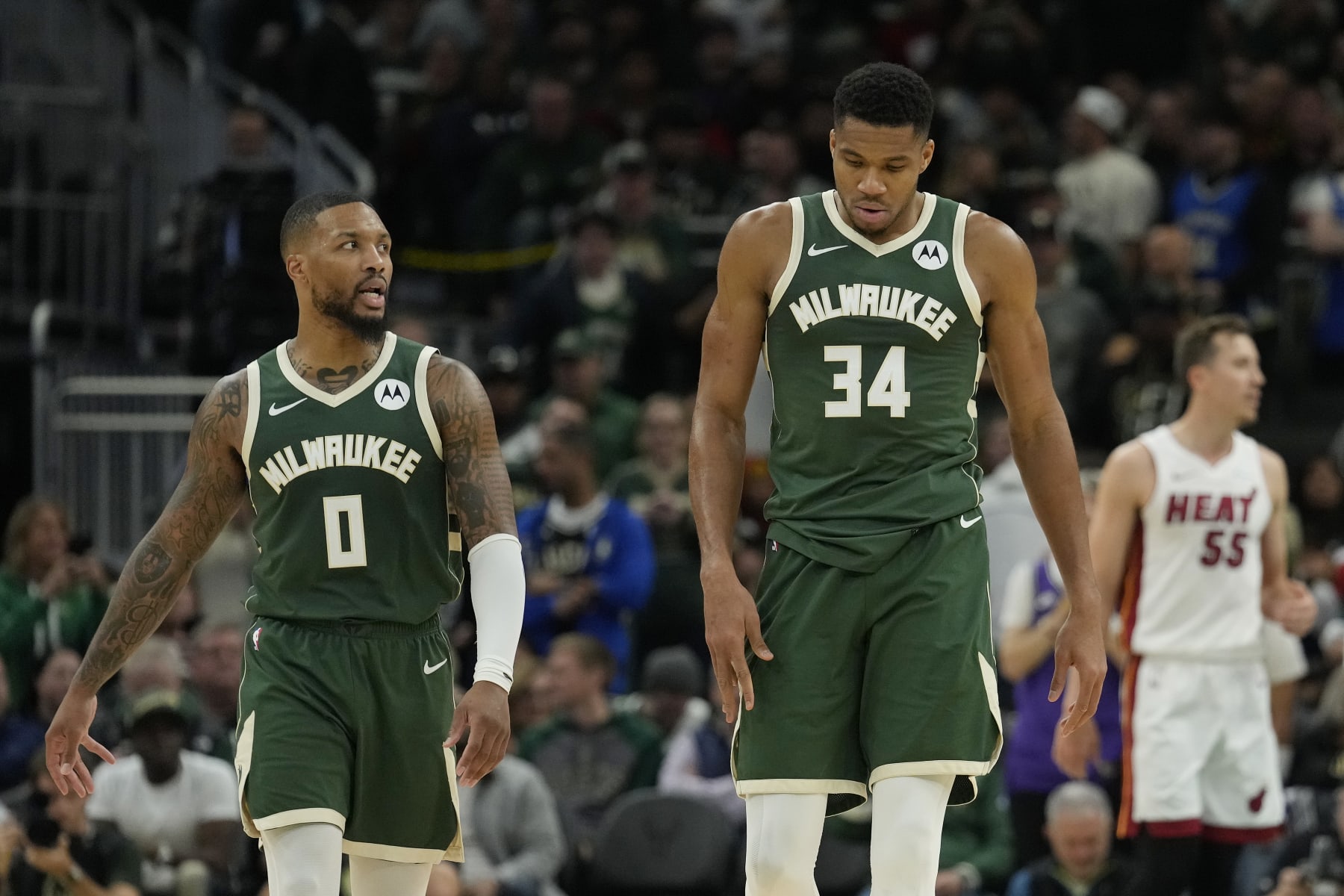 MILWAUKEE, WISCONSIN - OCTOBER 30: Damian Lillard #0 and Giannis Antetokounmpo #34 of the Milwaukee Bucks look on during the second half against the Miami Heat at Fiserv Forum on October 30, 2023 in Milwaukee, Wisconsin. NOTE TO USER: User expressly acknowledges and agrees that, by downloading and or using this photograph, User is consenting to the terms and conditions of the Getty Images License Agreement. (Photo by Patrick McDermott/Getty Images)