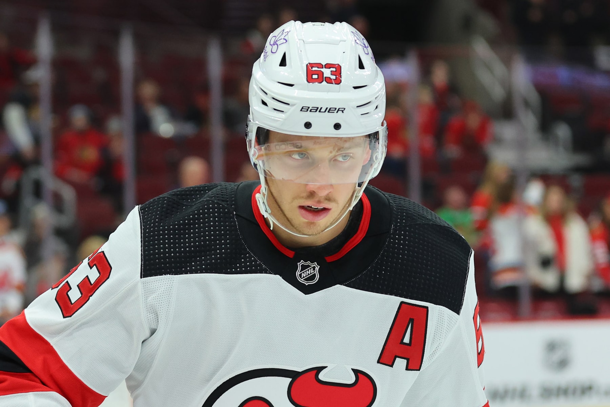 CHICAGO, ILLINOIS - NOVEMBER 05: Jesper Bratt #63 of the New Jersey Devils looks on prior to the game against the Chicago Blackhawks at the United Center on November 05, 2023 in Chicago, Illinois. (Photo by Michael Reaves/Getty Images)