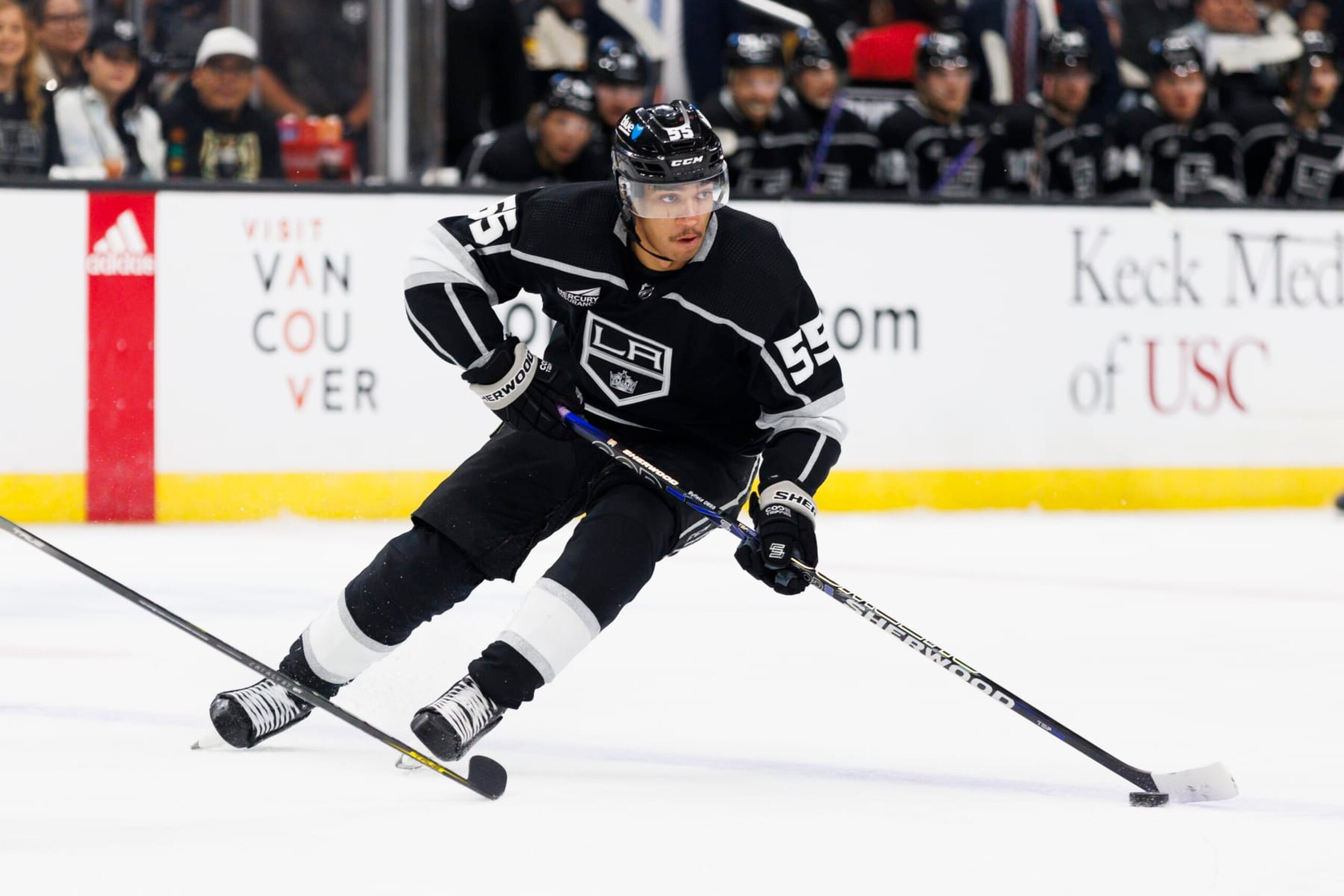 LOS ANGELES, CA - NOVEMBER 09: Los Angeles Kings center Quinton Byfield (55) skates with the puck during an NHL hockey game against the Pittsburgh Penguins on November 9, 2023 at Crypto.com Arena in Los Angeles, CA. (Photo by Ric Tapia/Icon Sportswire via Getty Images)