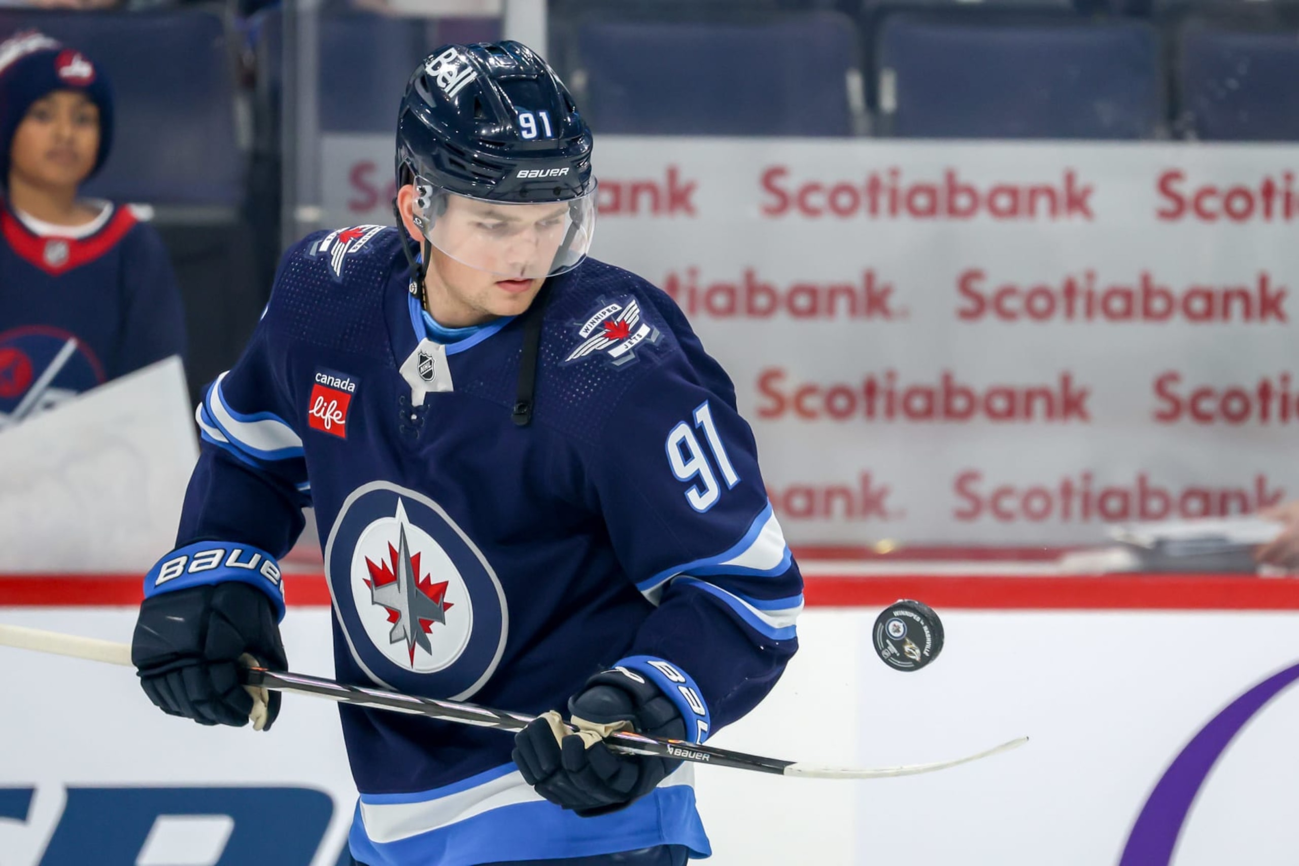 WINNIPEG, CANADA - NOVEMBER 9: Cole Perfetti #91 of the Winnipeg Jets takes part in the pre-game warm up prior to NHL action against the Nashville Predators at the Canada Life Centre on November 9, 2023 in Winnipeg, Manitoba, Canada. (Photo by Jonathan Kozub/NHLI via Getty Images)