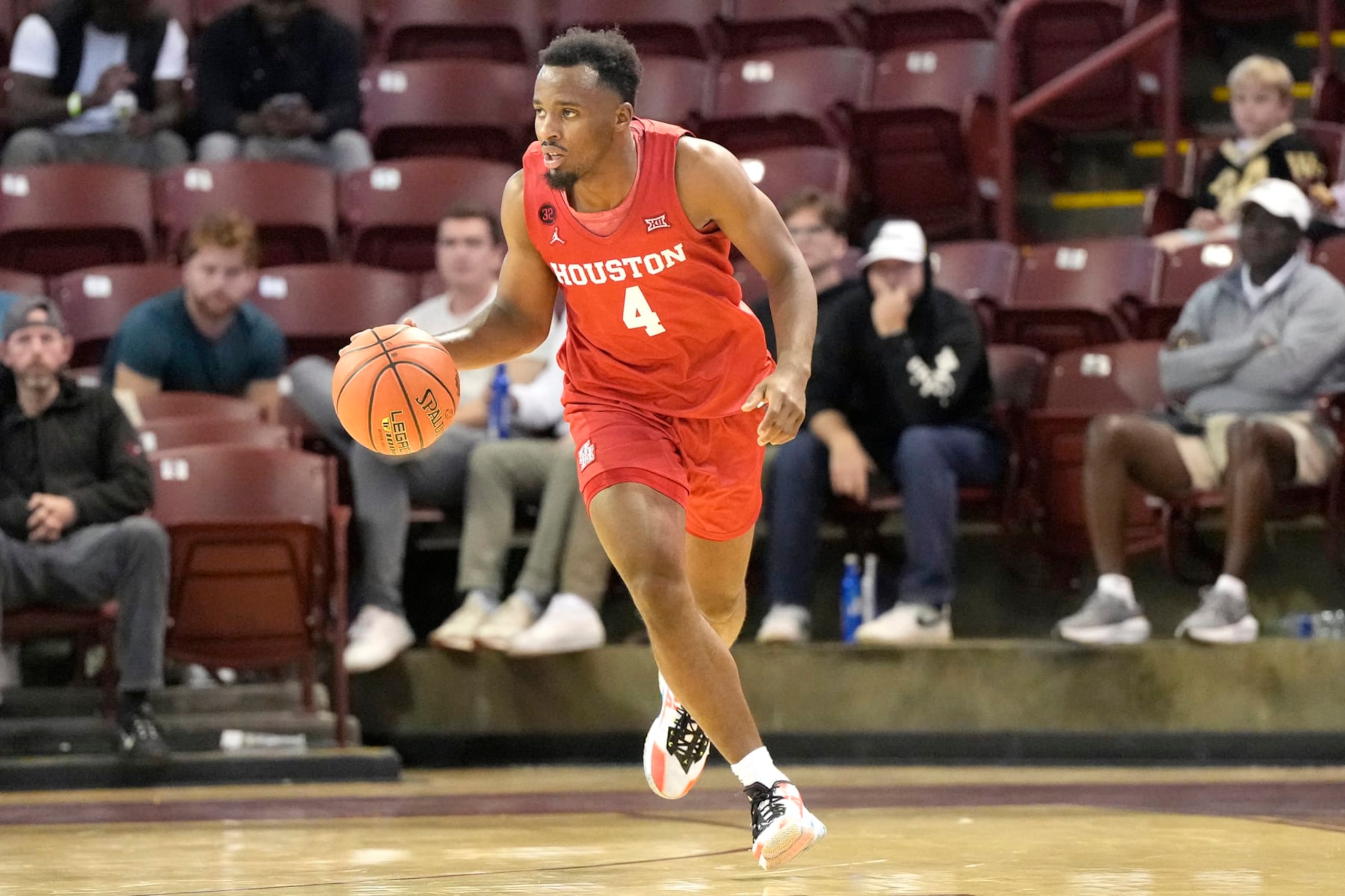 CHARLESTON, SC - NOVEMBER 16:  LJ Cryer #4 of the Houston Cougars dribbles up court in the second half during day one of the Shriners Children's Charleston Classic college basketball game against the Houston Cougars at the TD Arena on November 16, 2023 in Charleston, South Carolina.  (Photo by Mitchell Layton/Getty Images)
