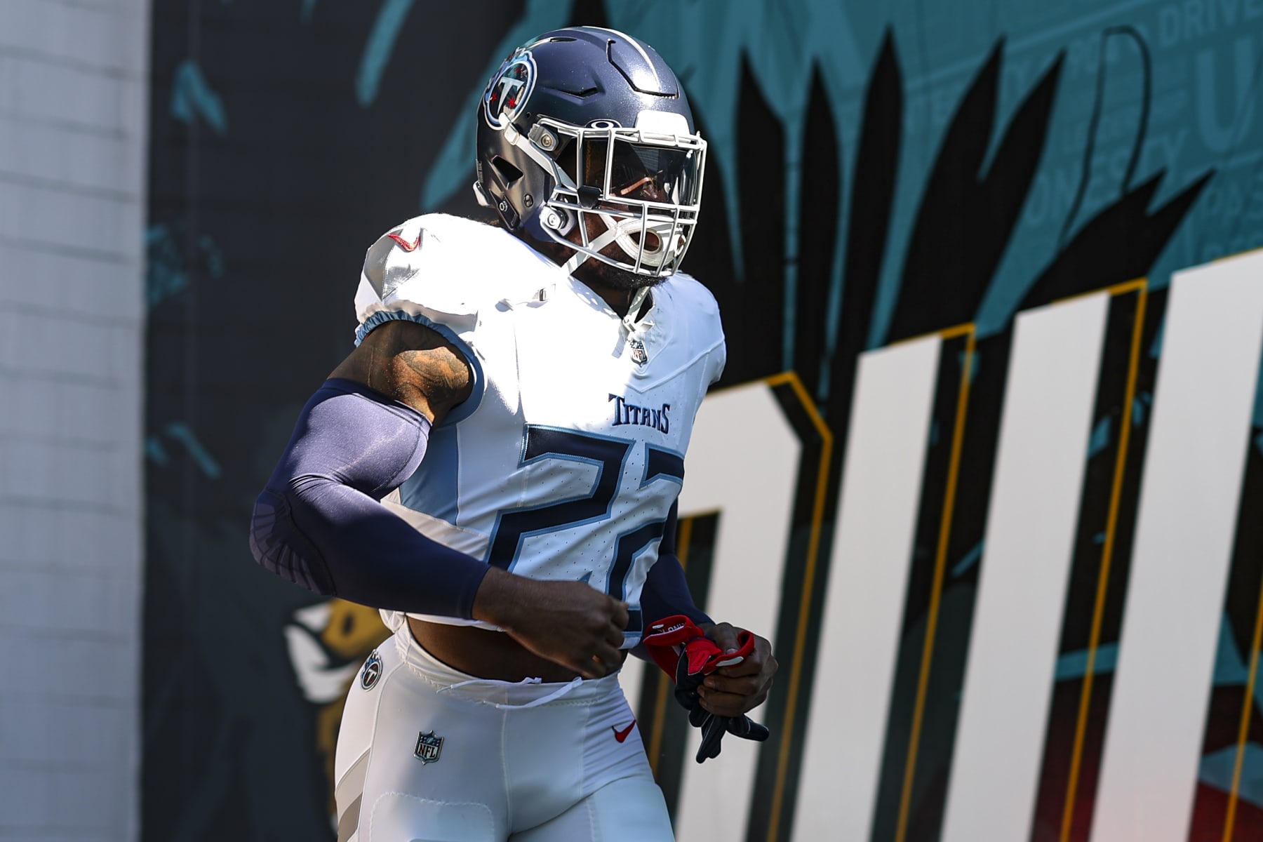 JACKSONVILLE, FL - NOVEMBER 19: Derrick Henry #22 of the Tennessee Titans runs out of the tunnel prior to an NFL football game against the Jacksonville Jaguars at EverBank Stadium on November 19, 2023 in Jacksonville, Florida. (Photo by Perry Knotts/Getty Images)