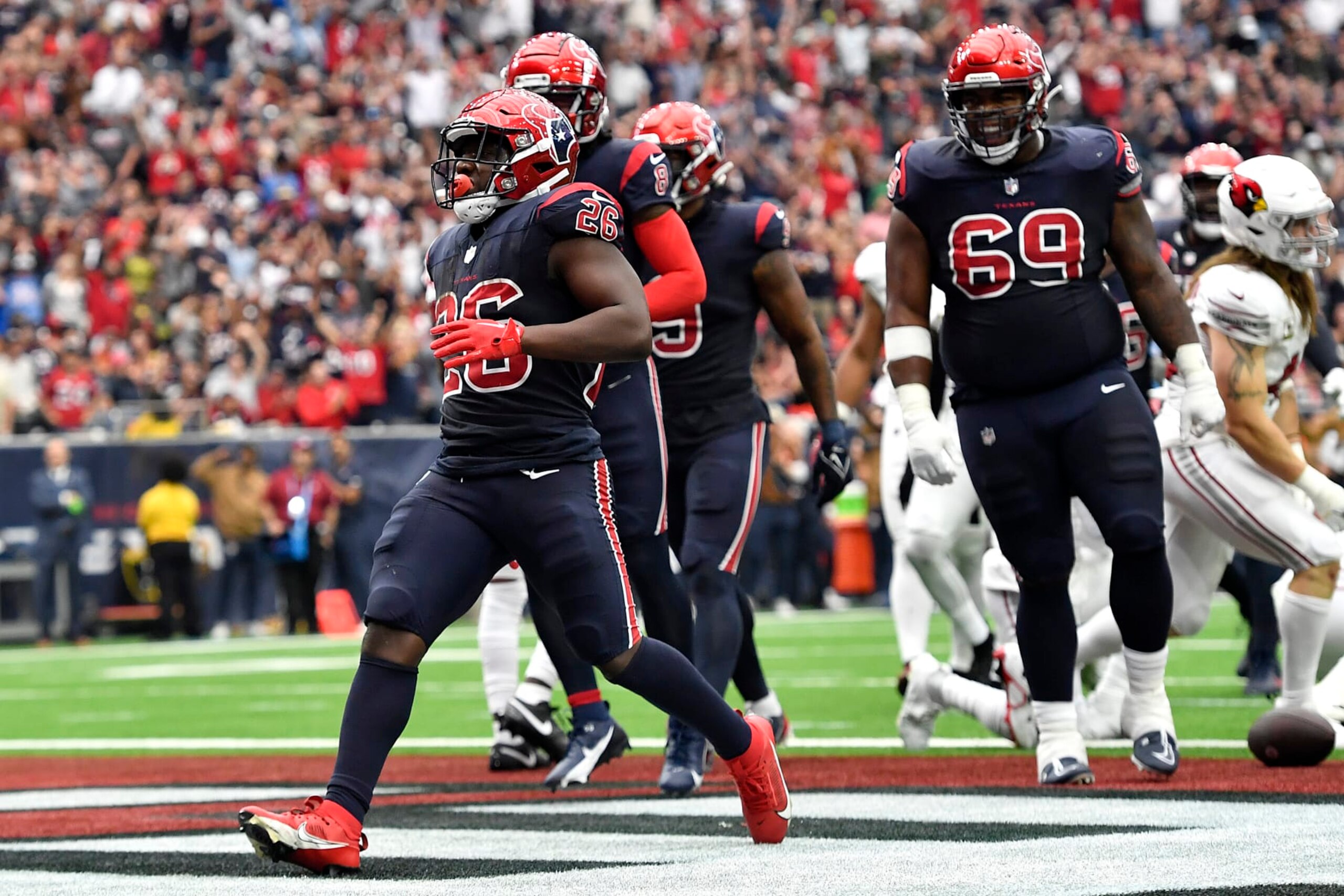 HOUSTON, TEXAS - NOVEMBER 19: Devin Singletary #26 of the Houston Texans scores a touchdown during the second quarter of a game against the Arizona Cardinals at NRG Stadium on November 19, 2023 in Houston, Texas. (Photo by Logan Riely/Getty Images)