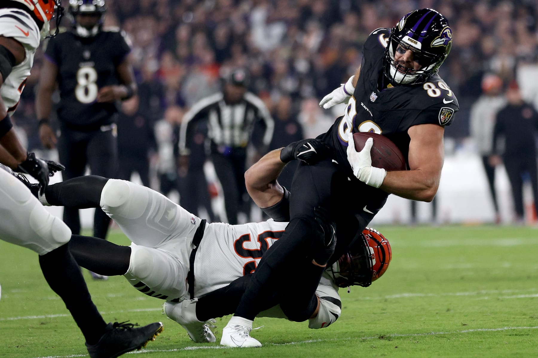 BALTIMORE, MARYLAND - NOVEMBER 16: Mark Andrews #89 of the Baltimore Ravens is tackled by Logan Wilson #55 of the Cincinnati Bengals during the first quarter of the game at M&T Bank Stadium on November 16, 2023 in Baltimore, Maryland. (Photo by Patrick Smith/Getty Images)