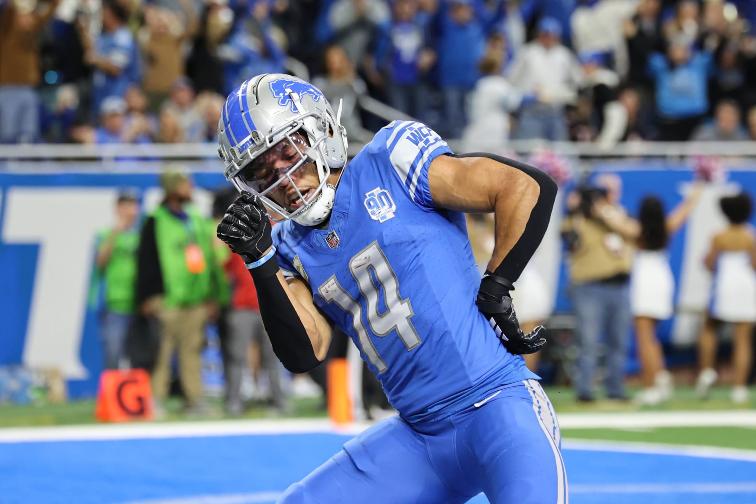 DETROIT, MI - NOVEMBER 19:  Detroit Lions wide receiver Amon-Ra St. Brown (14) performs a celebratory dance after catching a pass in the end zone for a touchdown during an NFL football game between the Chicago Bears and the Detroit Lions on November 19, 2023 at Ford Field in Detroit, Michigan.  (Photo by Scott W. Grau/Icon Sportswire via Getty Images)