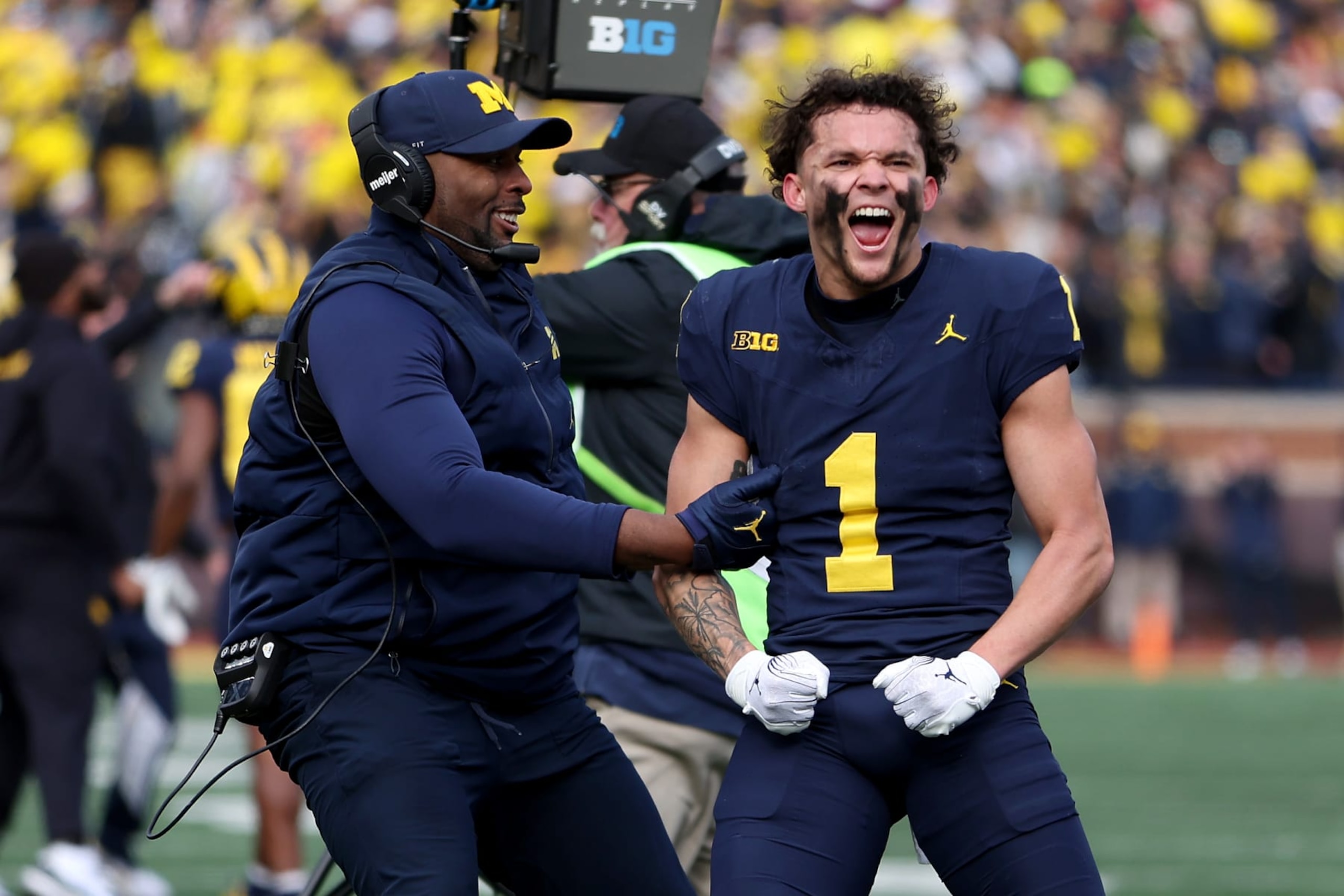 ANN ARBOR, MICHIGAN - NOVEMBER 25: Roman Wilson #1 of the Michigan Wolverines celebrates after the official review stands for the touchdown against the Ohio State Buckeyes during the second quarter in the game at Michigan Stadium on November 25, 2023 in Ann Arbor, Michigan. (Photo by Gregory Shamus/Getty Images)