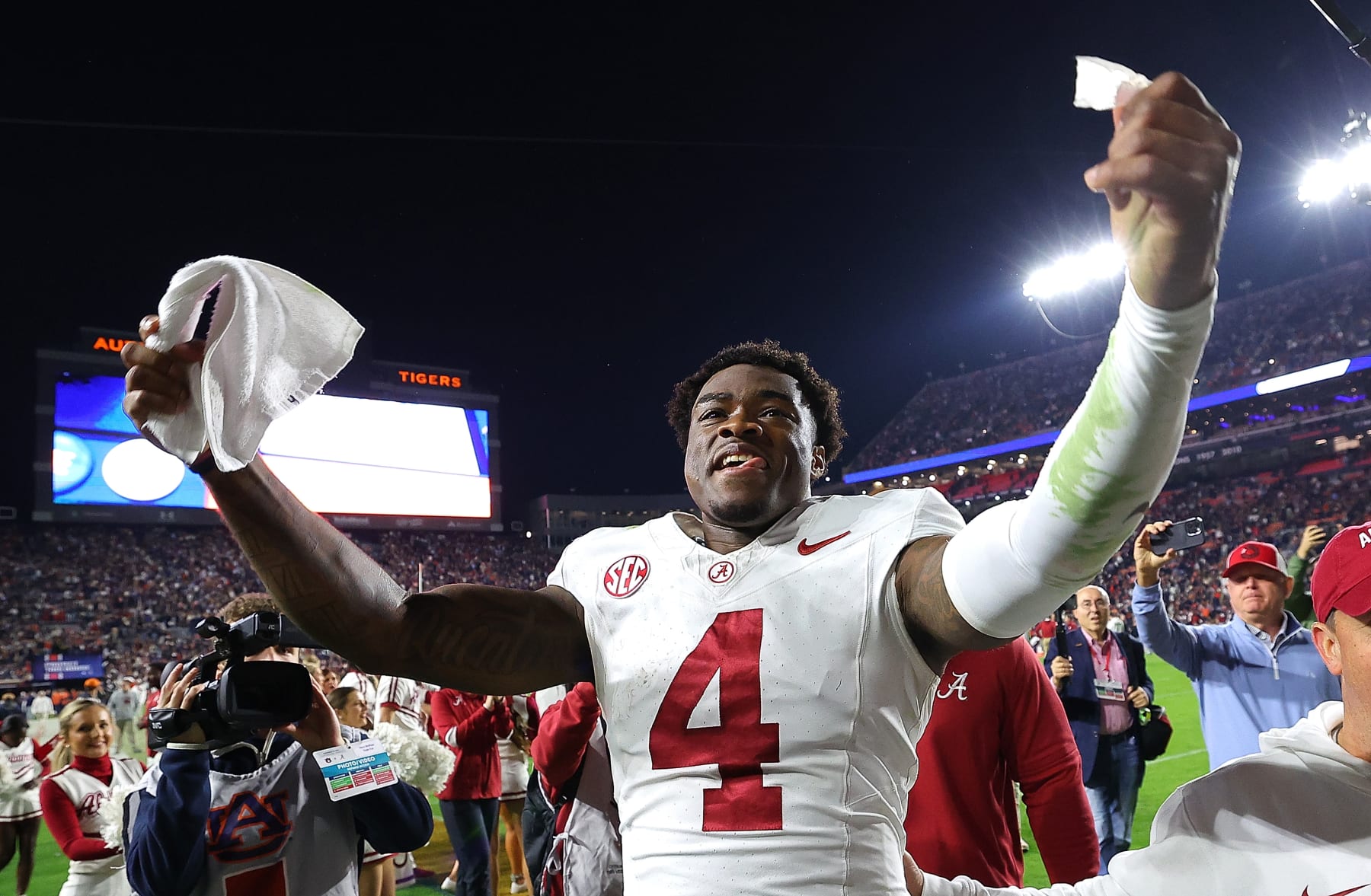 AUBURN, ALABAMA - NOVEMBER 25:  Jalen Milroe #4 of the Alabama Crimson Tide celebrates their 27-24 win over the Auburn Tigers at Jordan-Hare Stadium on November 25, 2023 in Auburn, Alabama. (Photo by Kevin C. Cox/Getty Images)