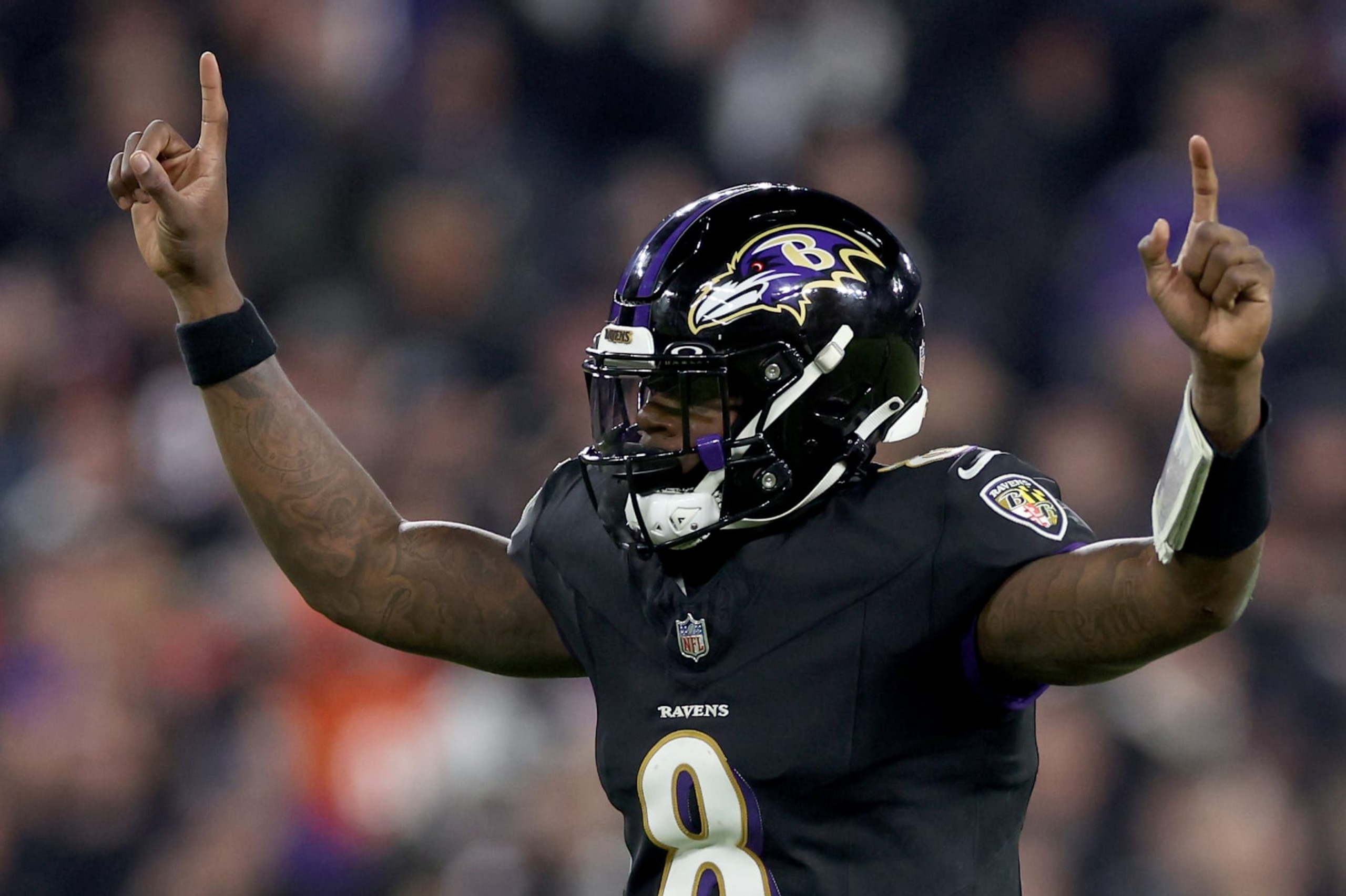 BALTIMORE, MARYLAND - NOVEMBER 16: Lamar Jackson #8 of the Baltimore Ravens celebrates a touchdown scored by Gus Edwards #35 against the Cincinnati Bengals during the fourth quarter of the game at M&T Bank Stadium on November 16, 2023 in Baltimore, Maryland. (Photo by Patrick Smith/Getty Images)
